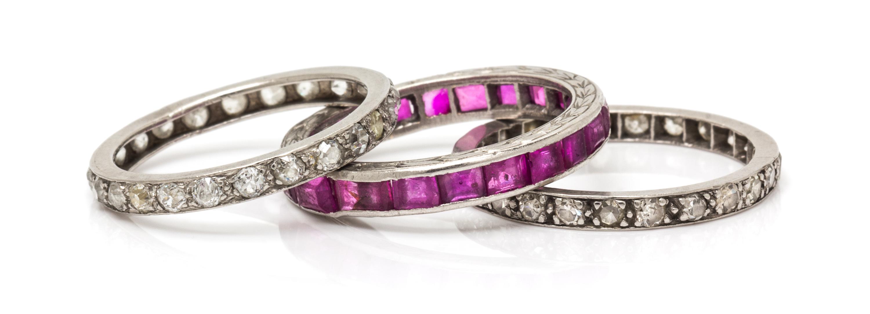 A Collection of Platinum, Diamond and Pink Sapphire Eternity Bands, 4.80 dwts.