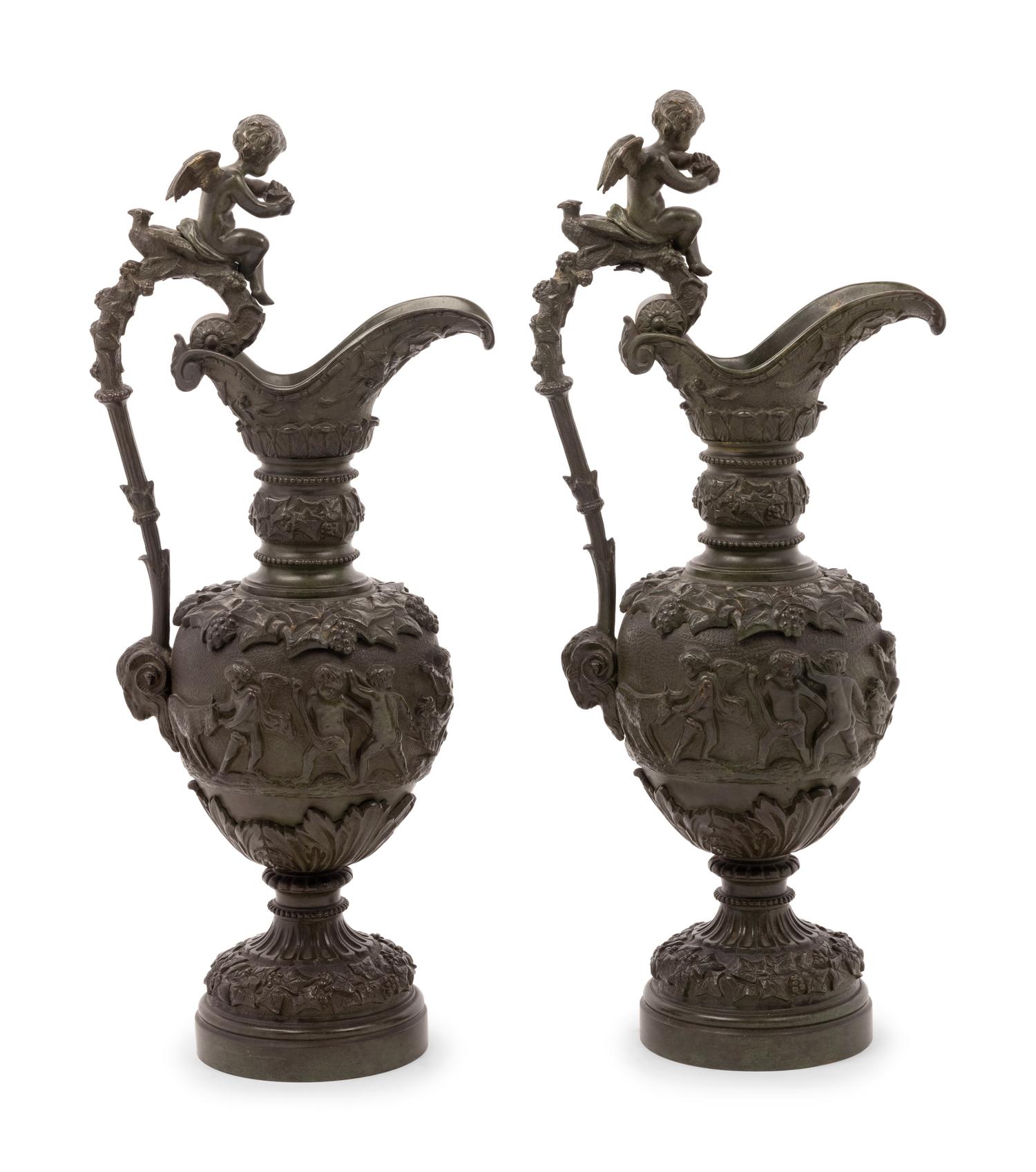 A Pair of Neoclassical Patinated Bronze Ewers with Bacchic Putti