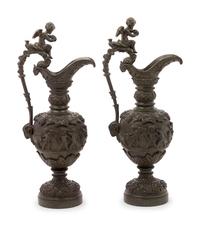A Pair of Neoclassical Patinated Bronze Ewers with Bacchic Putti