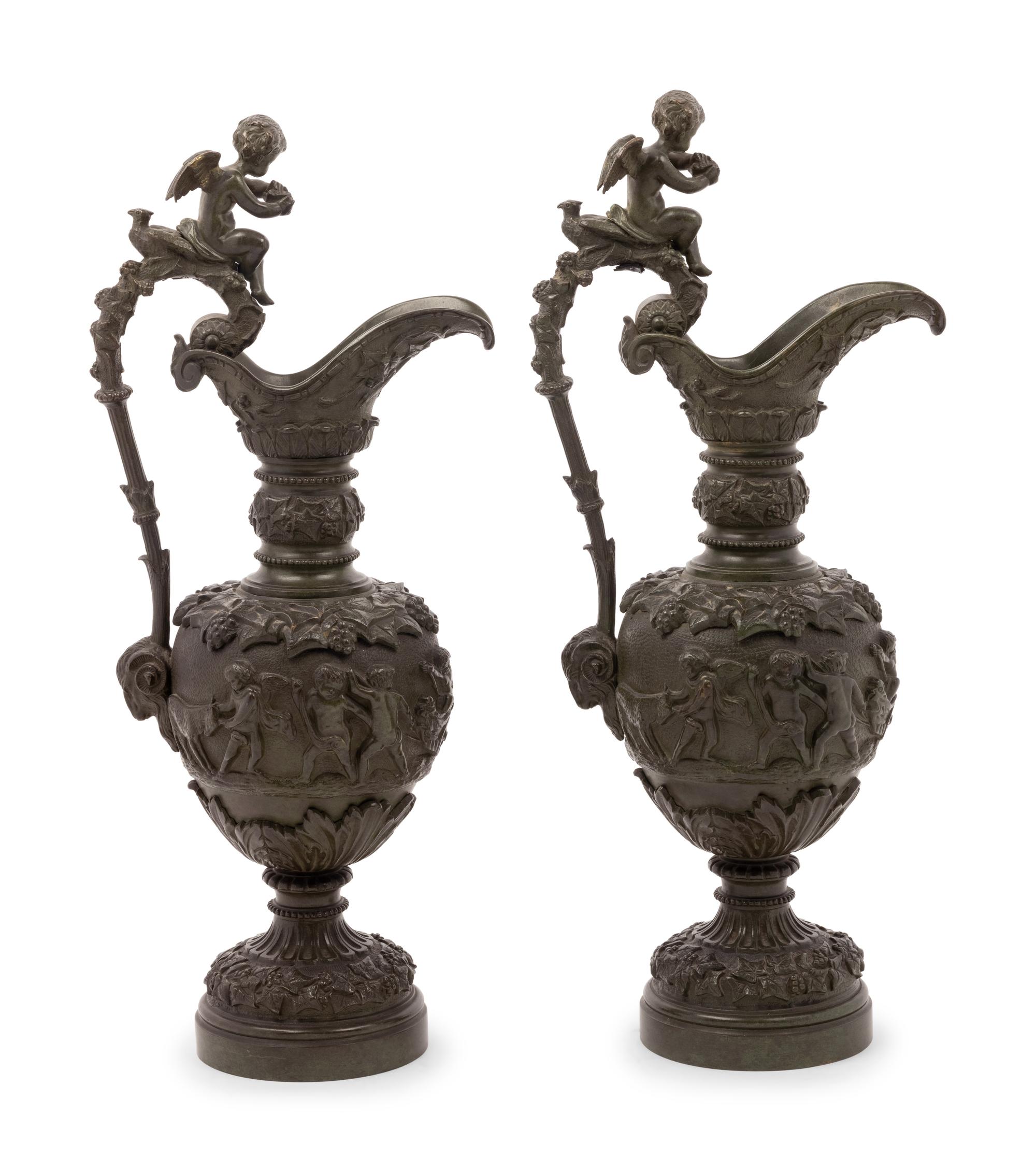 A Pair of Neoclassical Patinated Bronze Ewers with Bacchic Putti