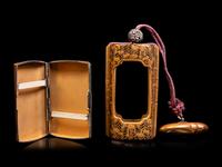 A Gold and Black Lacquer Inro Case and A Brass Cigarette Case