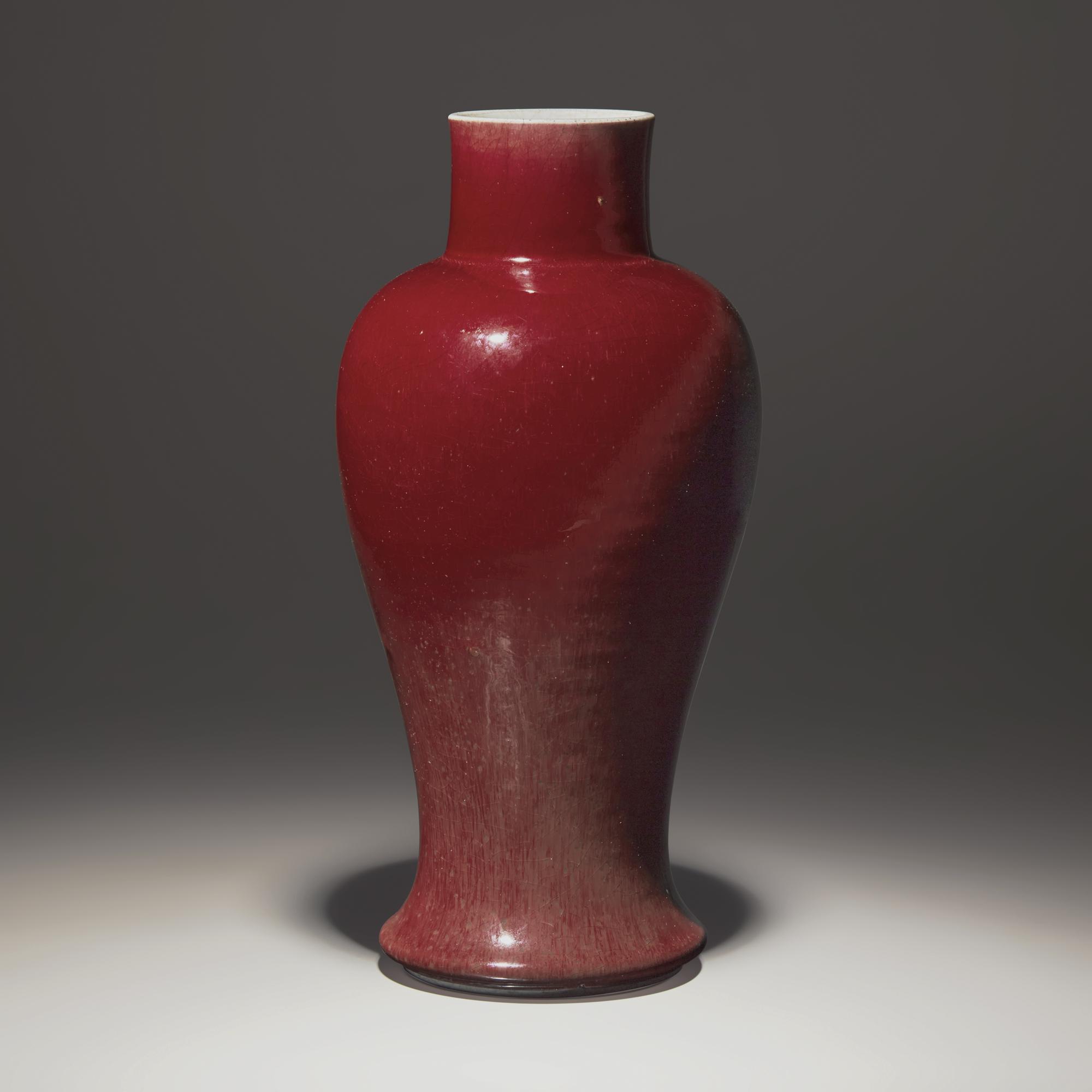 A Chinese Copper Red Glazed Porcelain Vase, 18th/19th Century — 清中期 紅釉觀音瓶