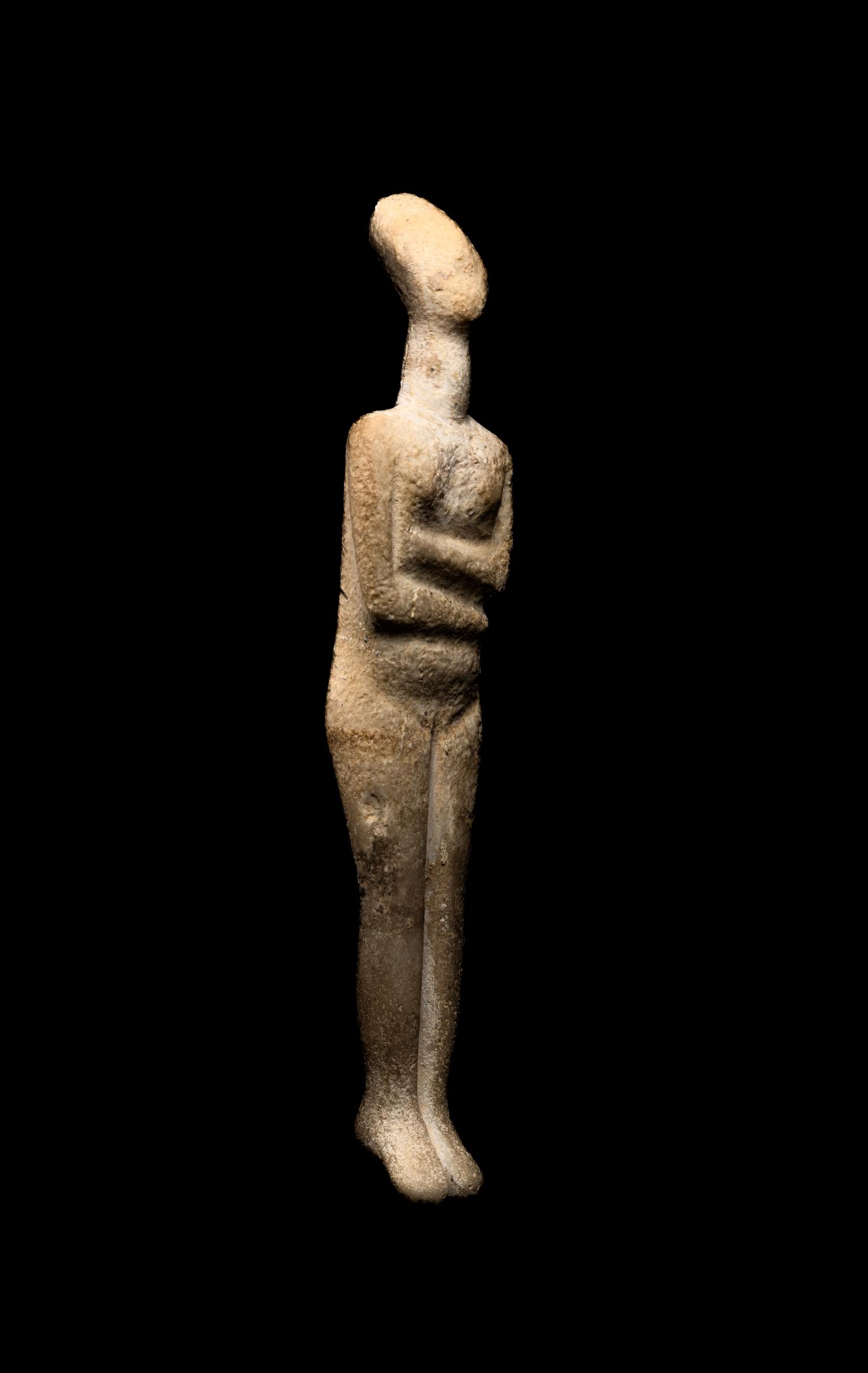 A Cycladic Marble Reclining Female Figure