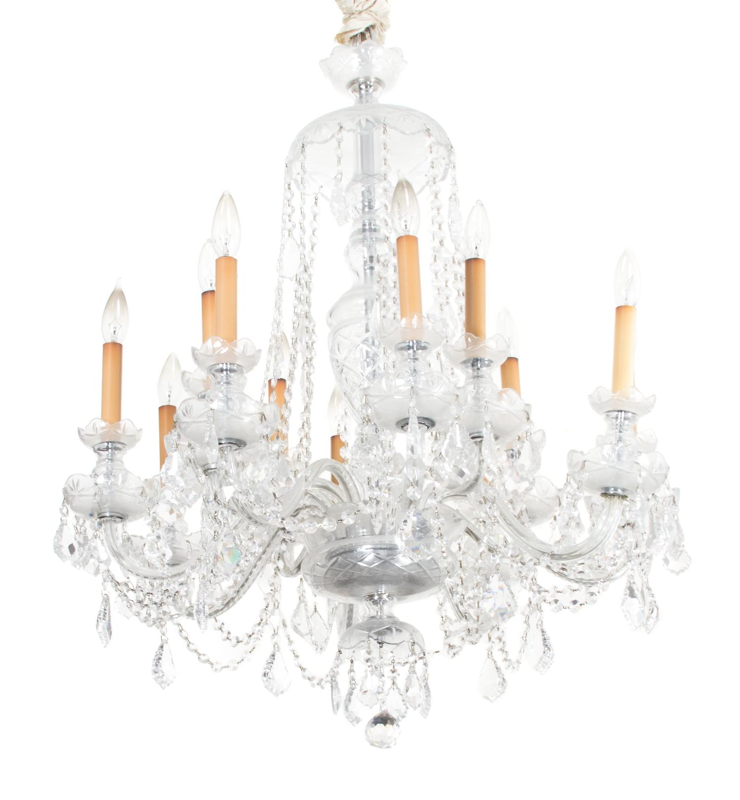 A Cut Glass Twelve Light Chandelier Height 35 to top of first hanger x diameter 27 inches. — 20TH CENTURY