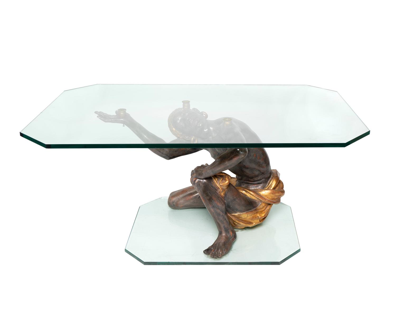 A Venetian Style Ebonized and Parcel Gilt Blackamoor Table — 20TH CENTURY