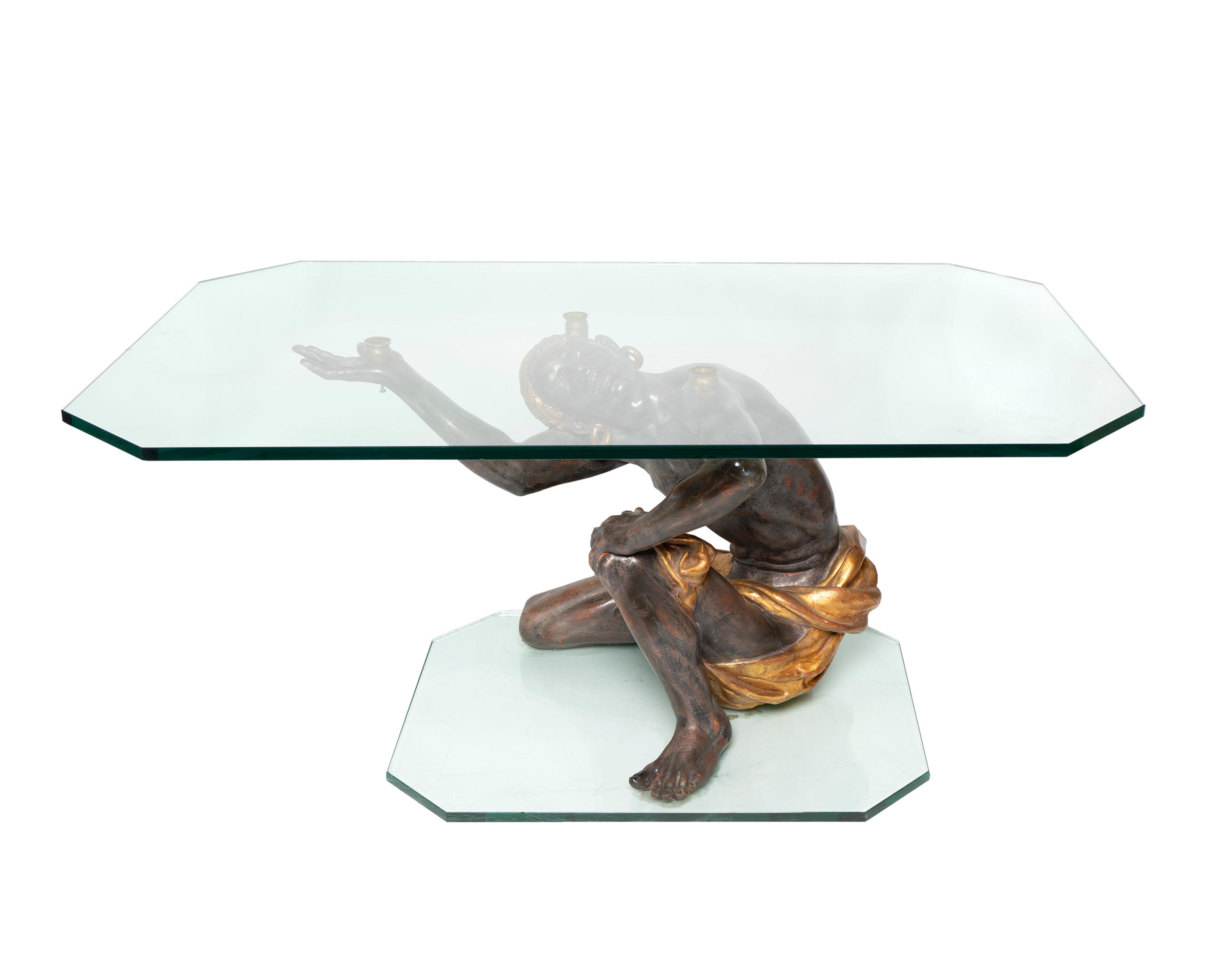 A Venetian Style Ebonized and Parcel Gilt Blackamoor Table — 20TH CENTURY