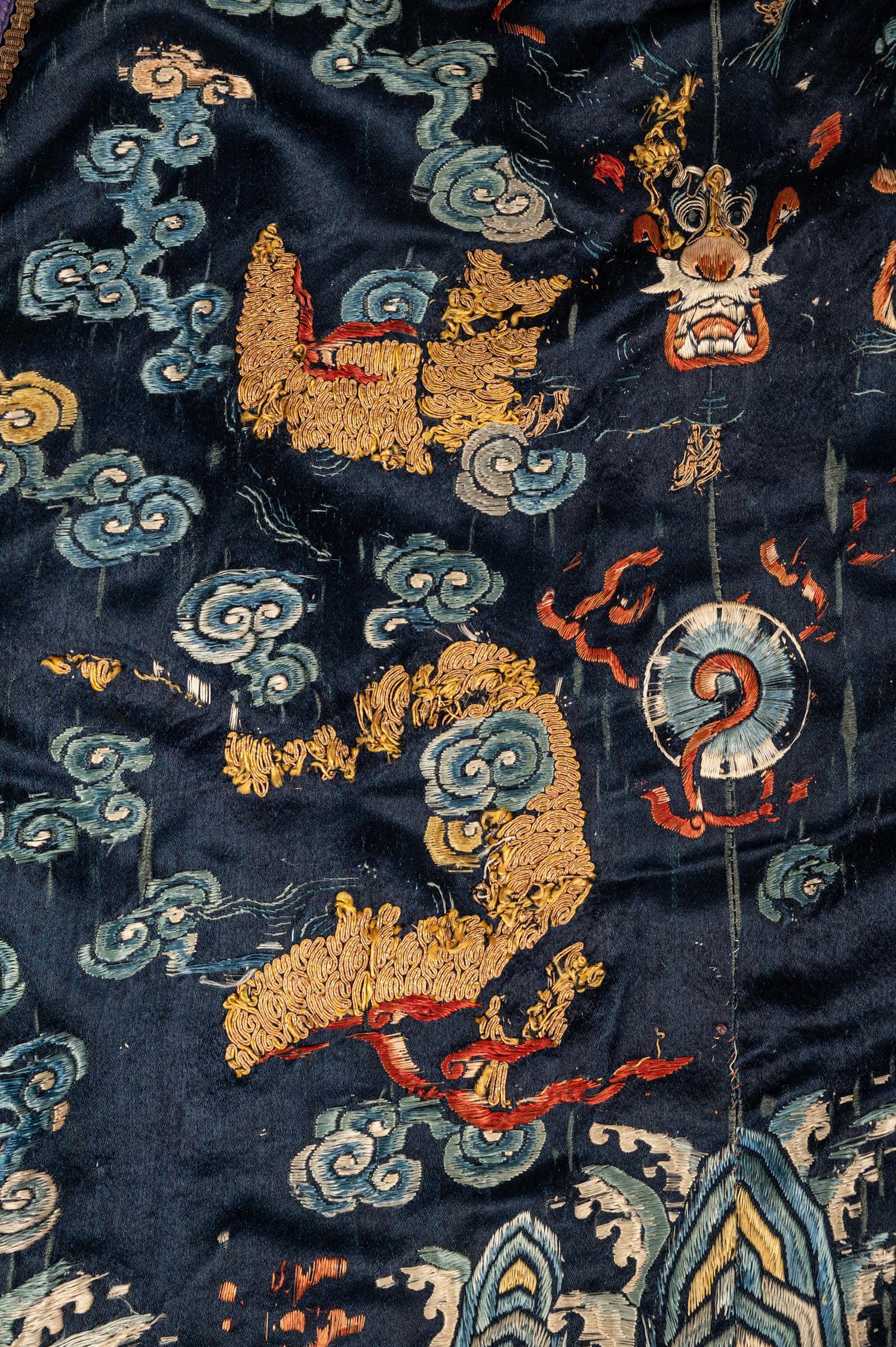 A Chinese Navy Blue Ground Embroidered Silk Court Robe, Chaofu