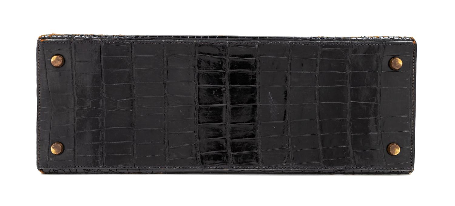 An Hermès Vintage Black Crocodile Kelly Bag, 9" L x 13" W x 4.5" D; Handle drop: 4.5".