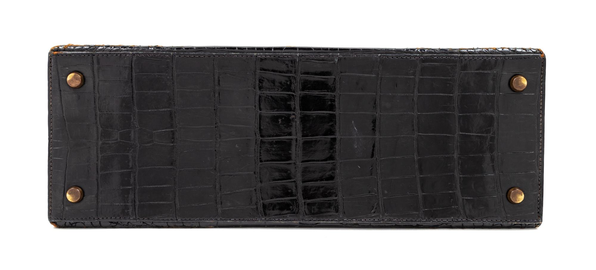 An Hermès Vintage Black Crocodile Kelly Bag, 9" L x 13" W x 4.5" D; Handle drop: 4.5".