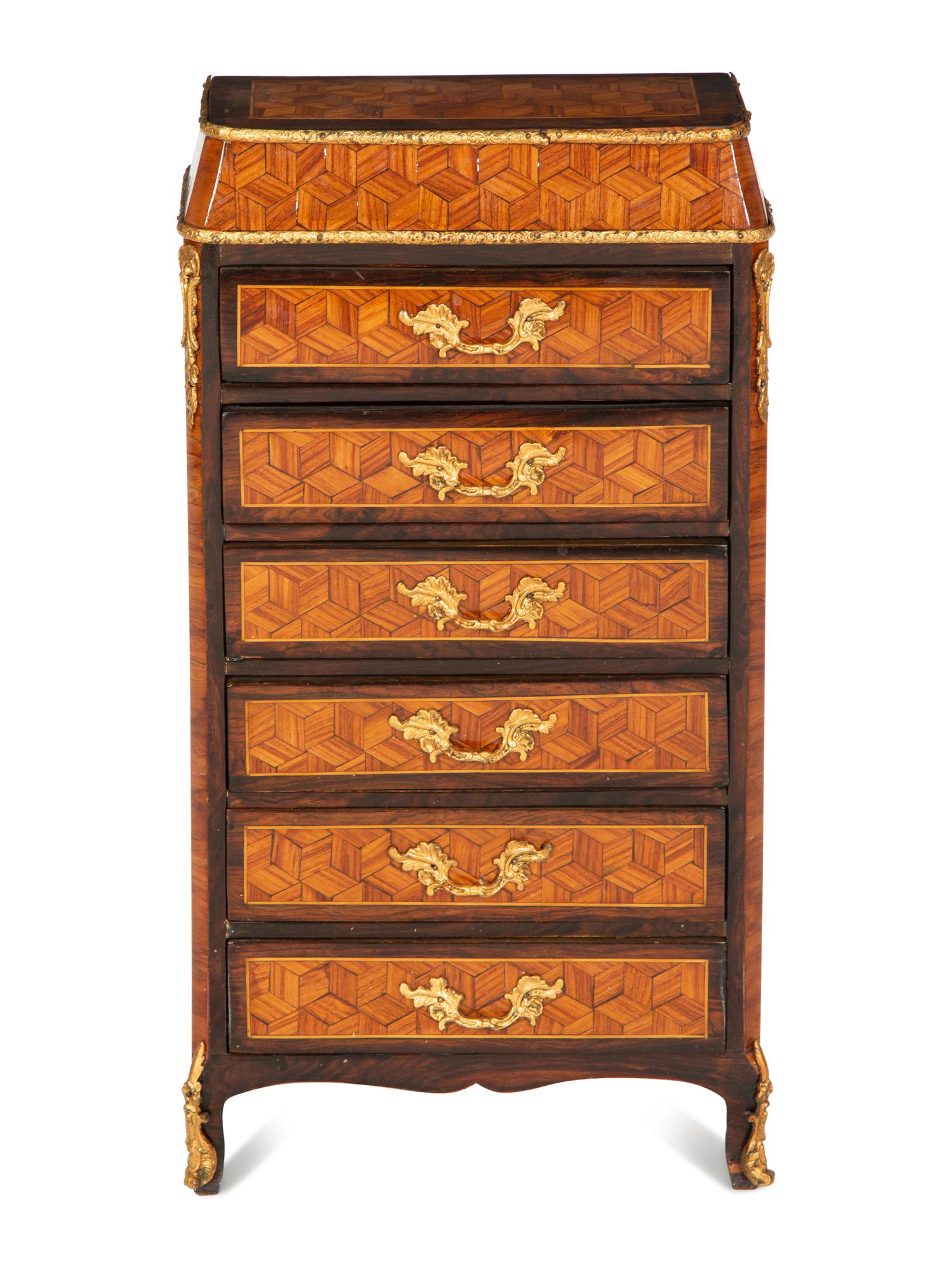 A Diminutive Gilt Bronze Mounted Parquetry Chest of Drawers
