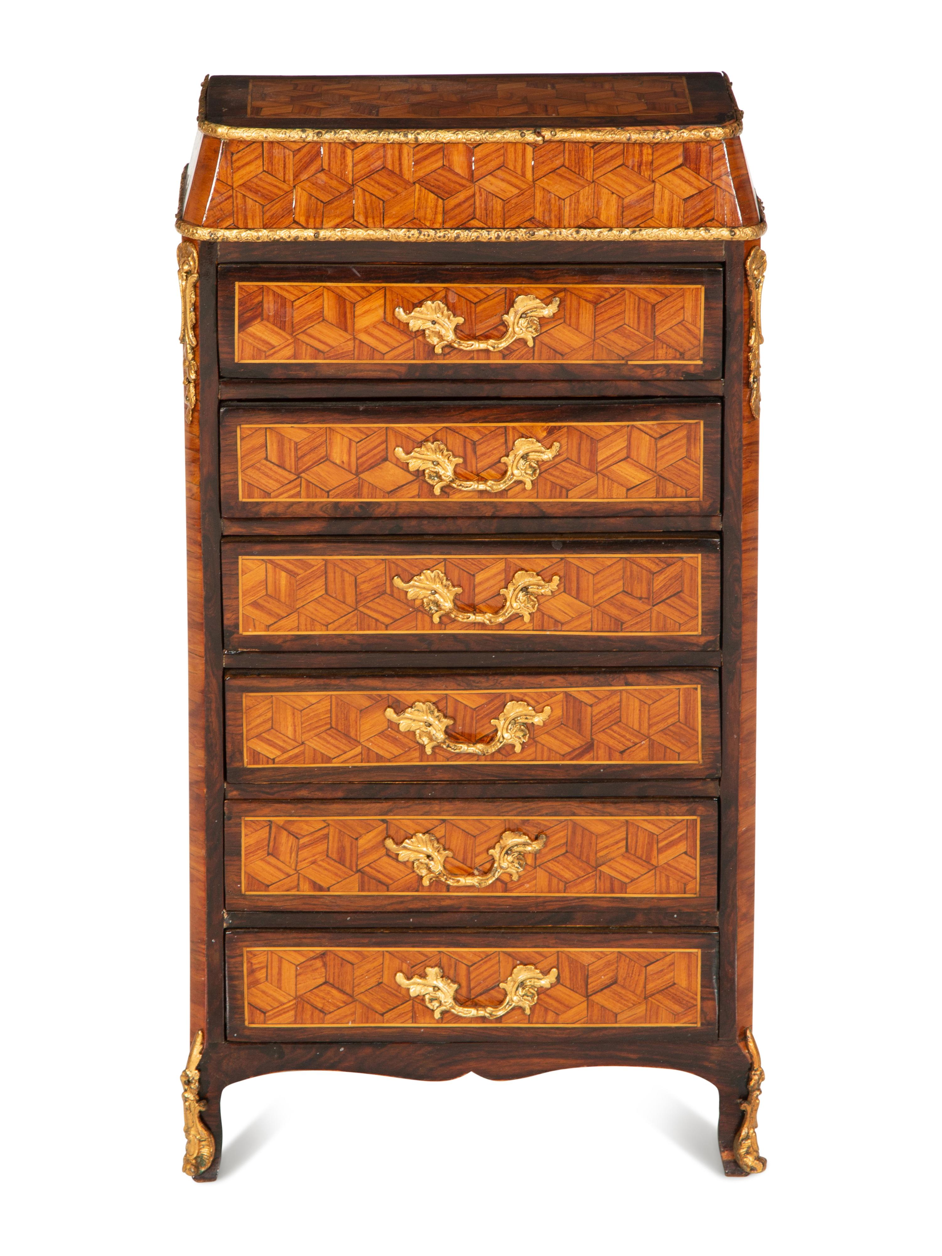 A Diminutive Gilt Bronze Mounted Parquetry Chest of Drawers
