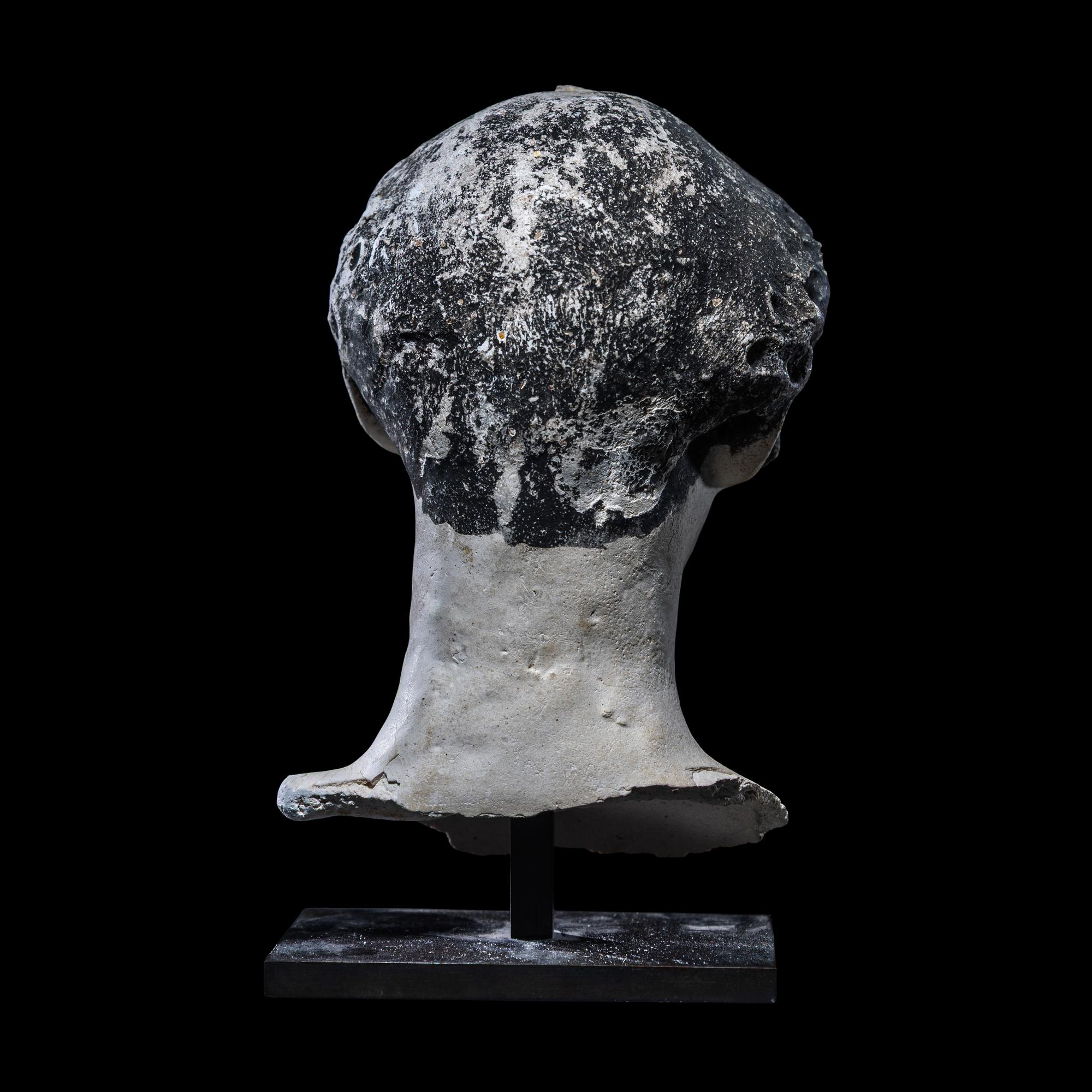 An Egyptian Painted Stucco Mummy Mask