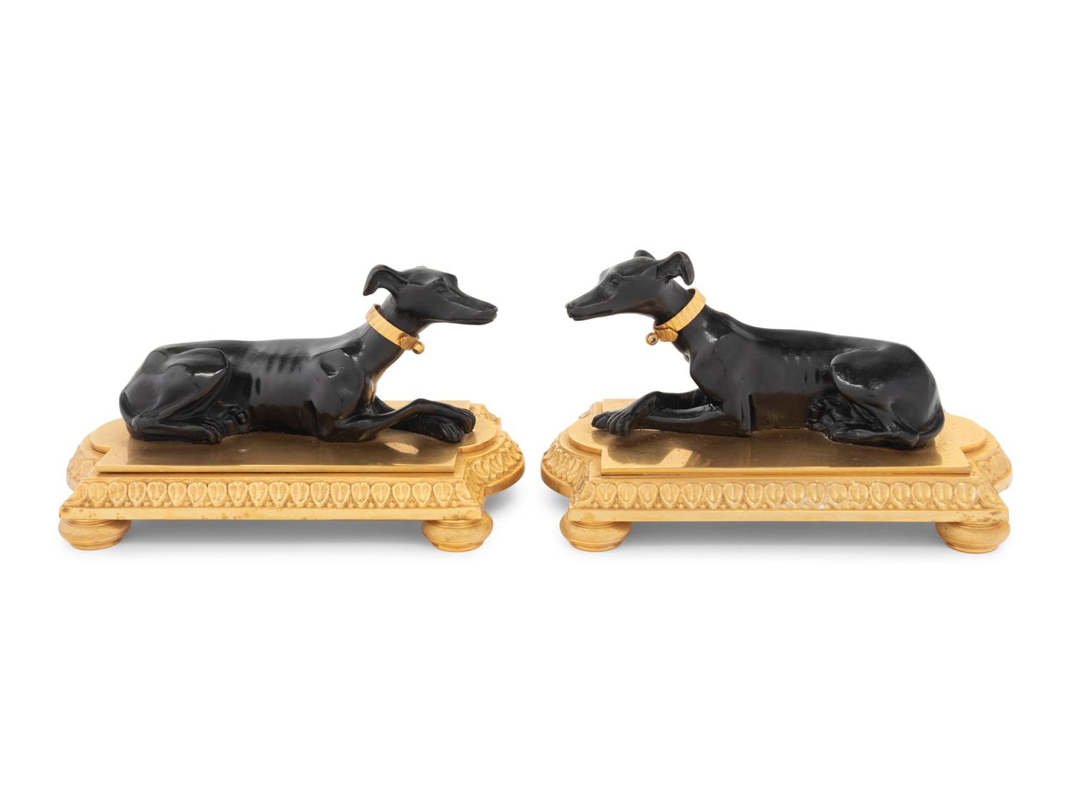 A Pair of French Gilt and Patinated Bronze Models of Greyhounds