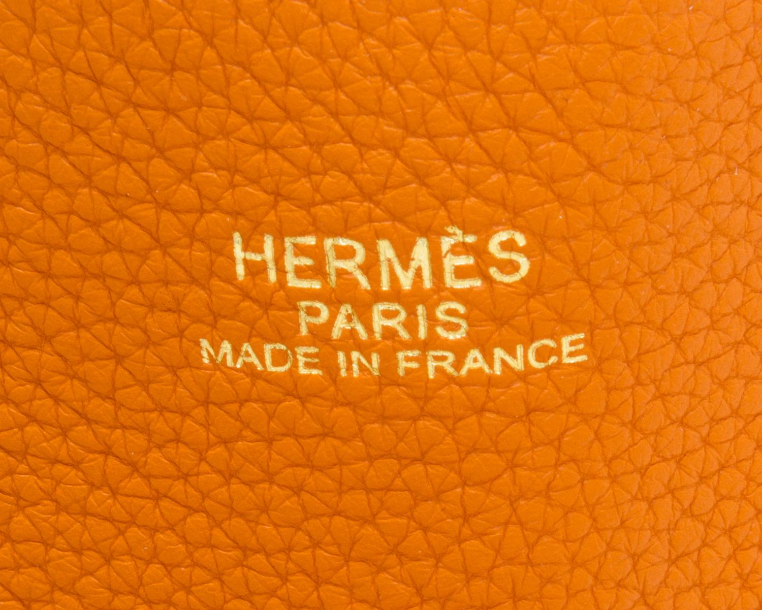 An Hermes Orange/Gold 45cm Taurillon Clemence Double Sens Tote, 17.5" x 15.5" x 5".