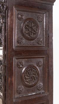 A Gothic Revival Carved Walnut Cabinet on Stand