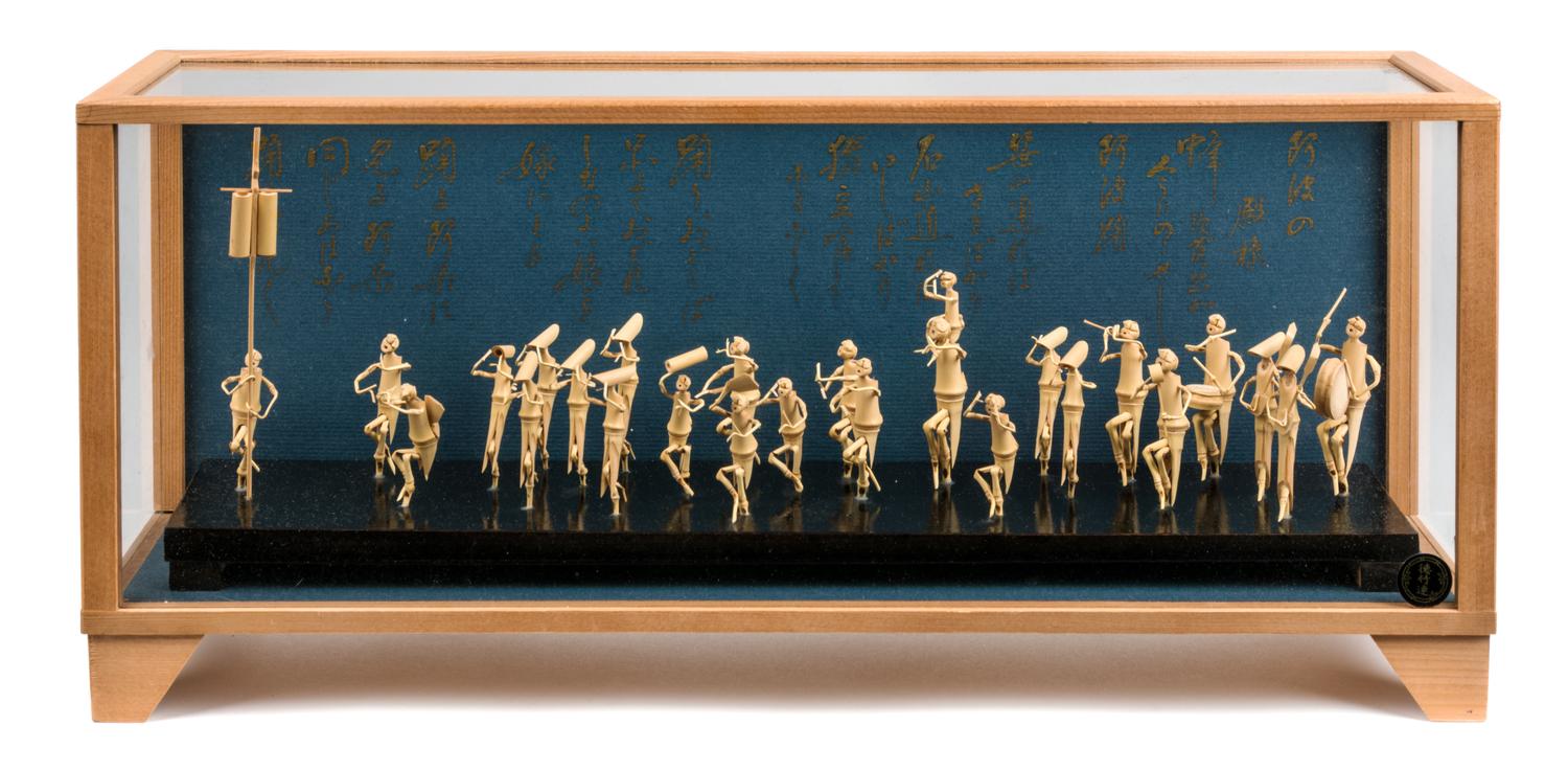 A Japanese Model of a Festival Dance Height 8 1/8 x width 18 3/8 x depth 4 3/4 inches.