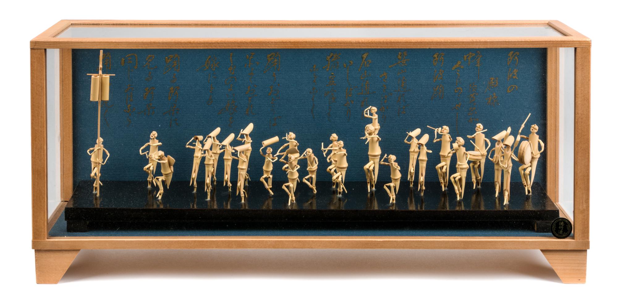 A Japanese Model of a Festival Dance Height 8 1/8 x width 18 3/8 x depth 4 3/4 inches.
