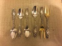 A Group of American Silver Flatware, Whiting Mfg. Co., New York, NY, Lily pattern, comprising: 12 dessert forks 22 teaspoons 3 butter s