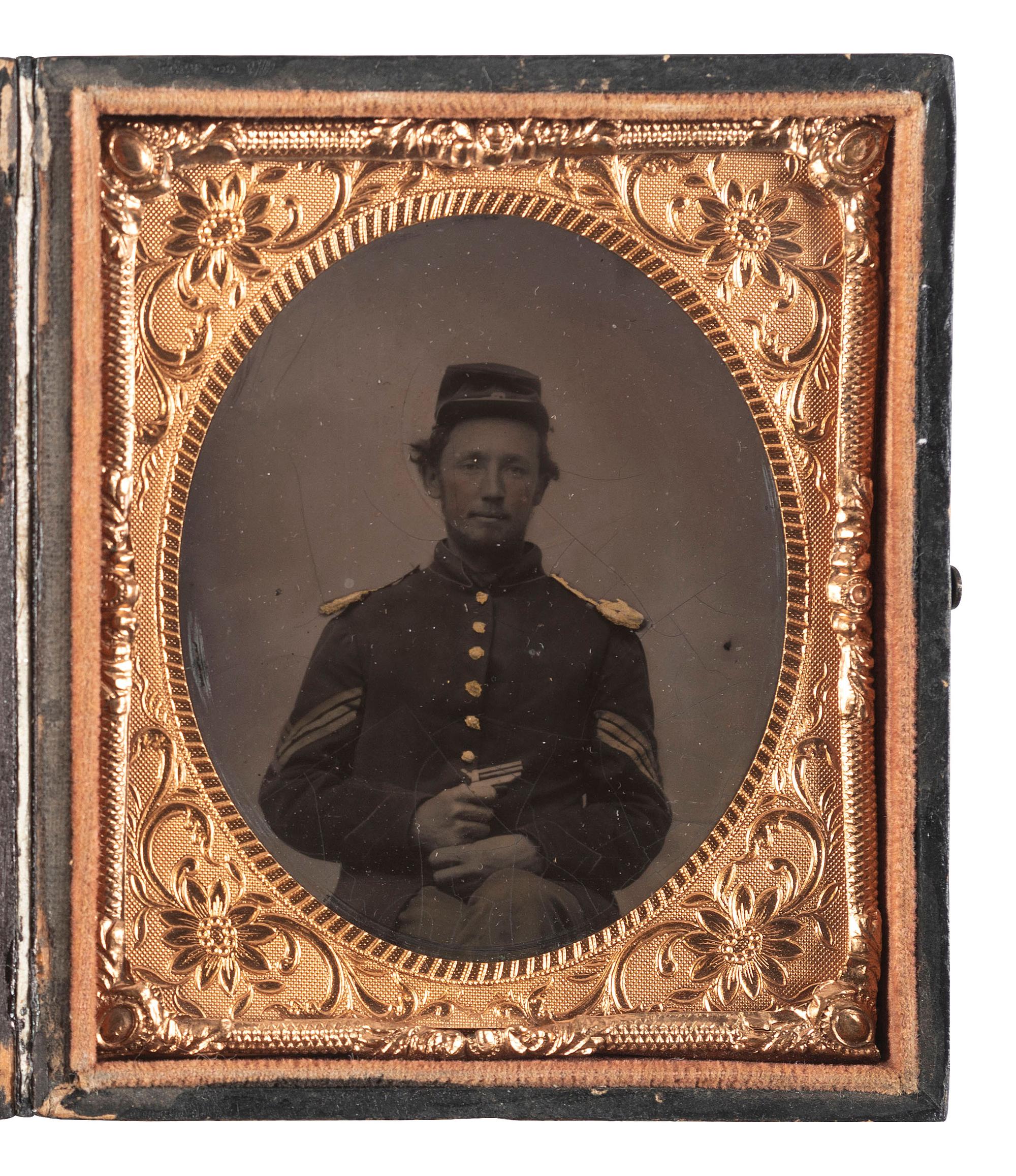 [CIVIL WAR]. Sixth plate tintype of a Union sergeant holding a Sharps four-barrel pistol.