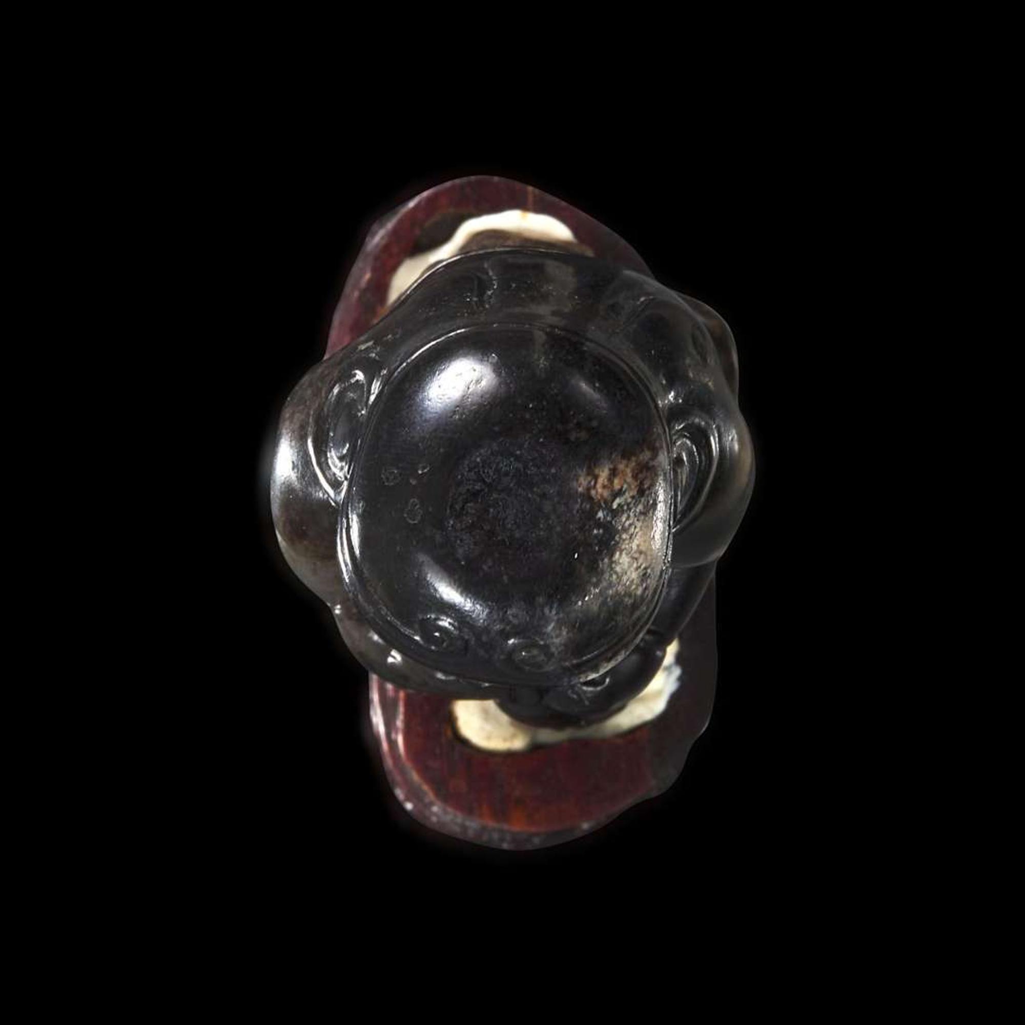 An unusual Chinese dark brown-black jade carving of a Lohan 笑狮罗汉玉雕 Ming dynasty or earlier ????