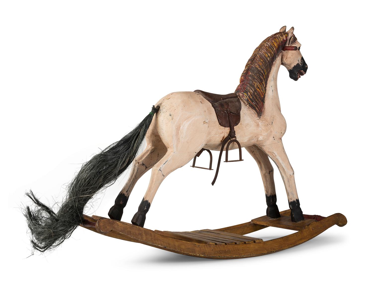 A Carved and Painted Wooden Rocking Horse
