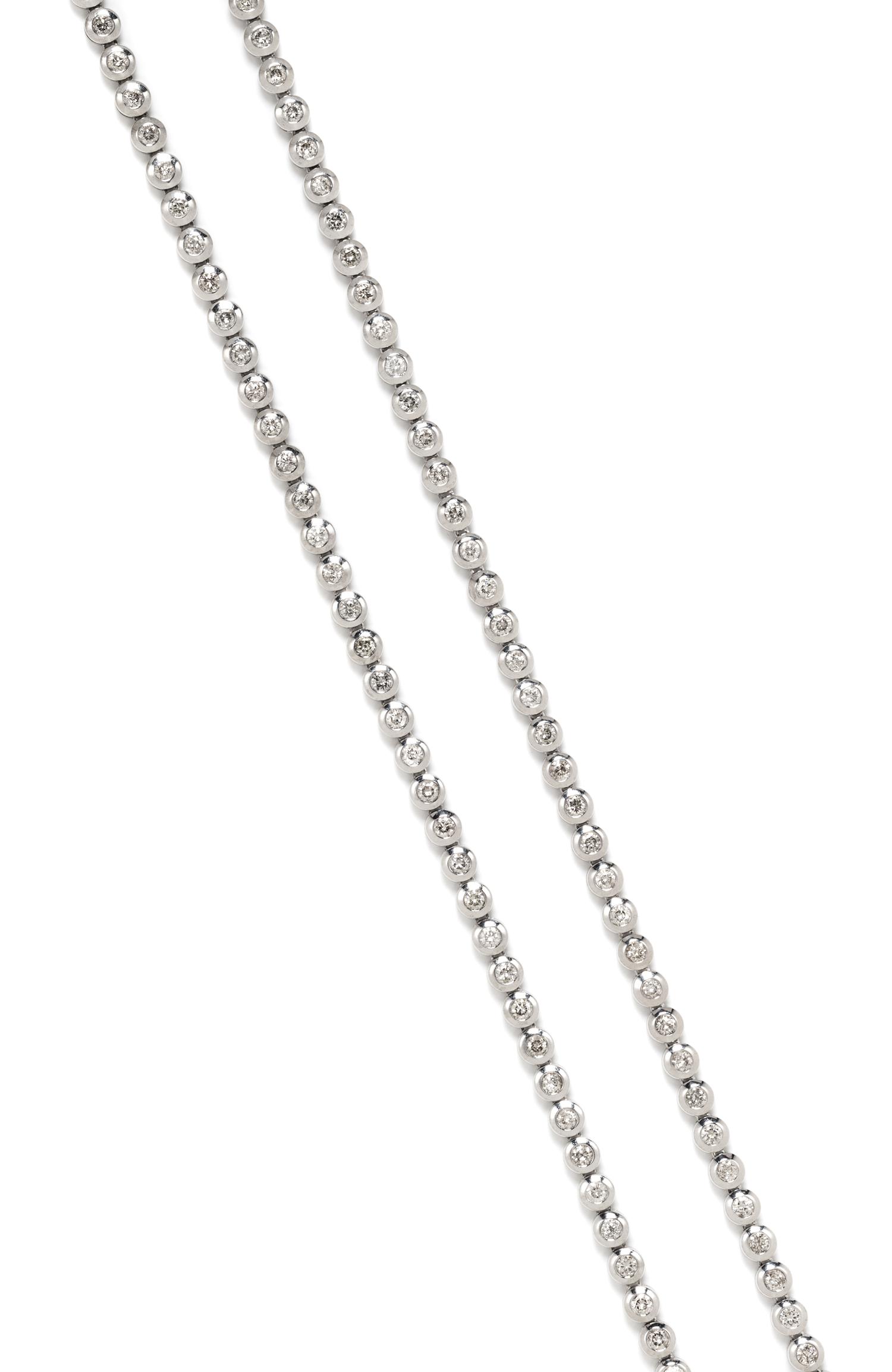 A 14 Karat White Gold and Diamond Longchain Riviere Necklace, 62.30 dwts.