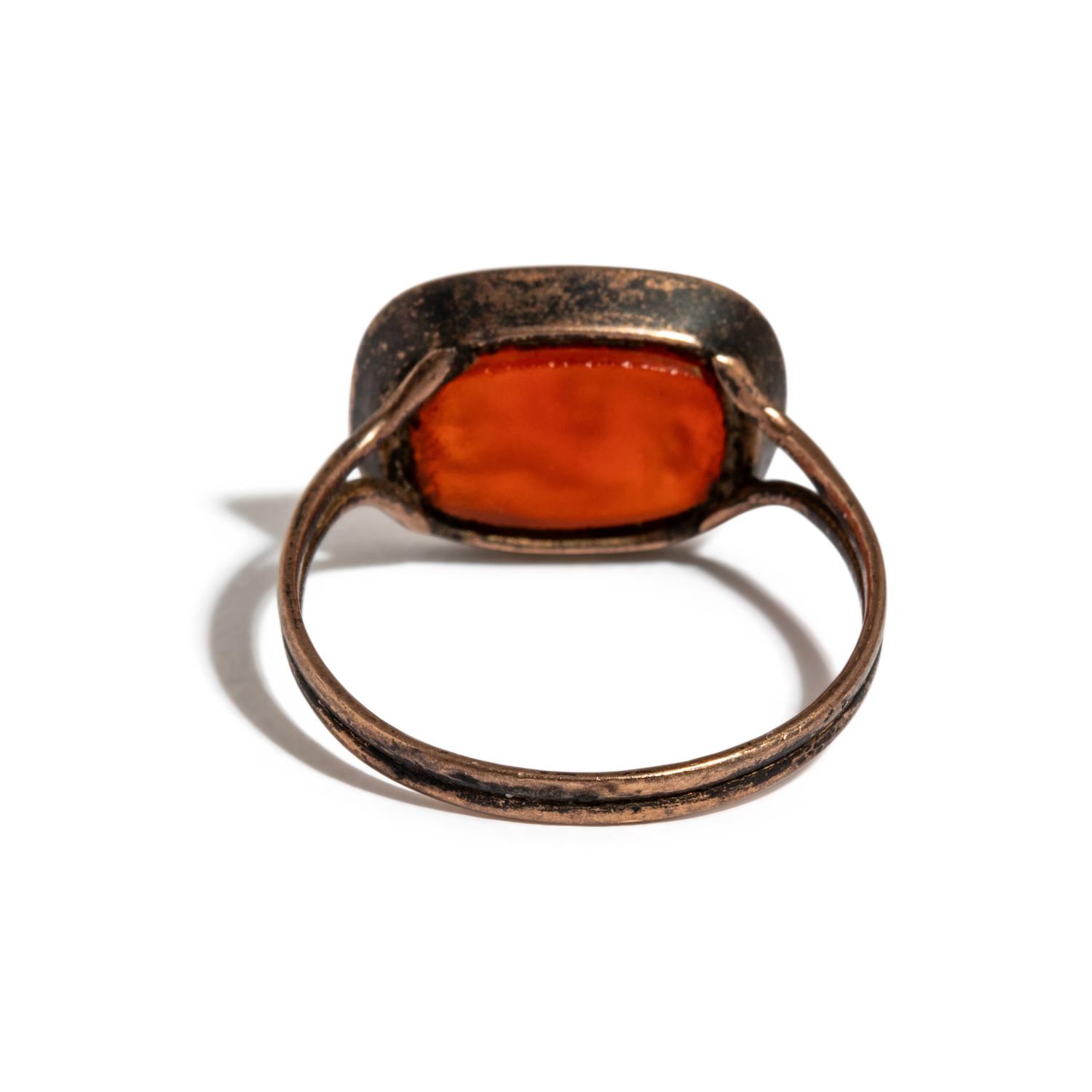 A Roman Carnelian Ring Stone with the God Eros Beside a Tropaion — Set in a gilt-copper ring