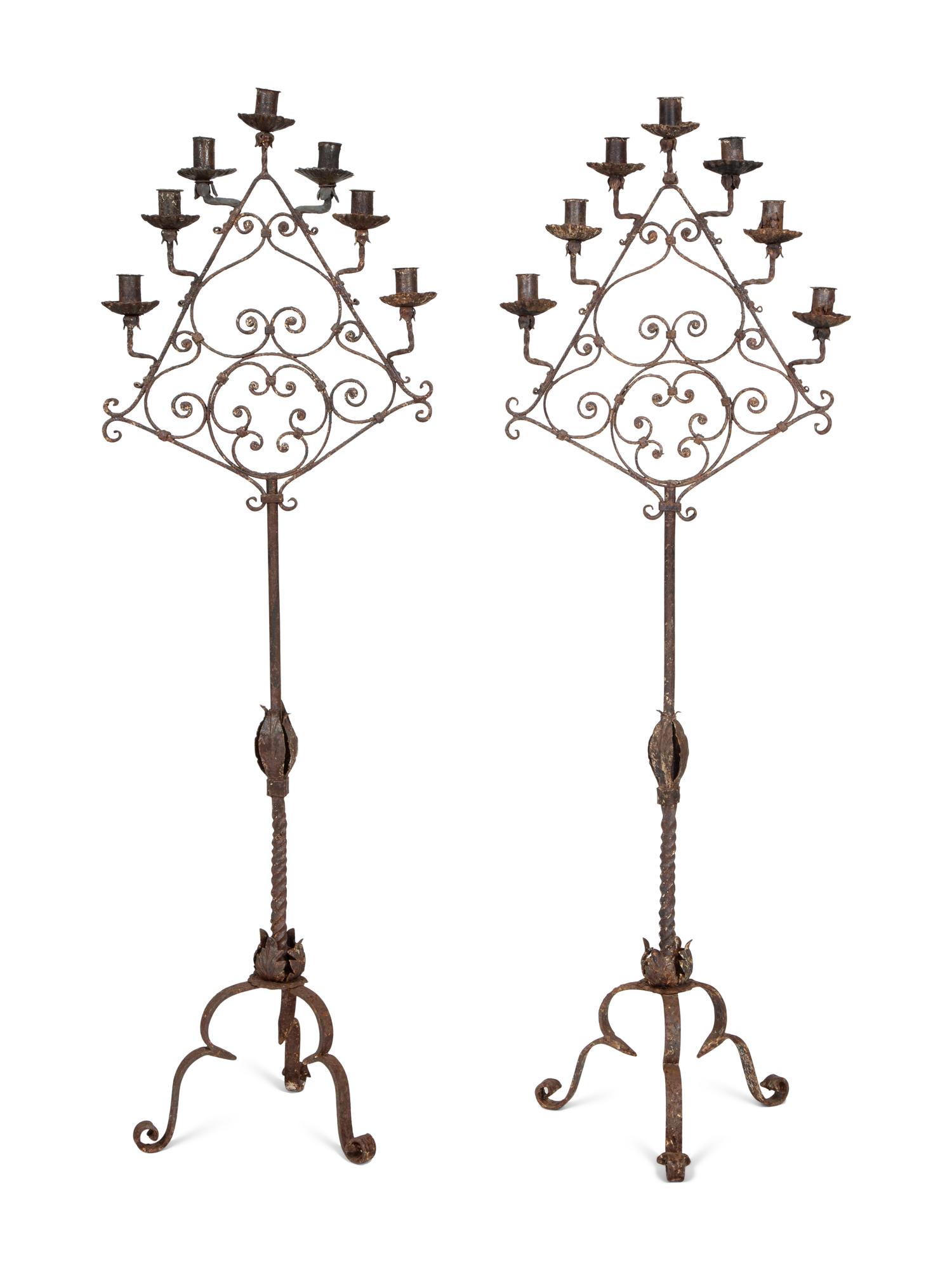 A Pair of Mizner Wrought Iron Seven-Light Floor Candelabra