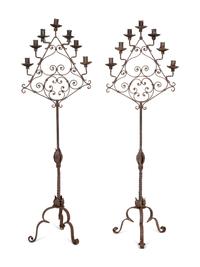 A Pair of Mizner Wrought Iron Seven-Light Floor Candelabra