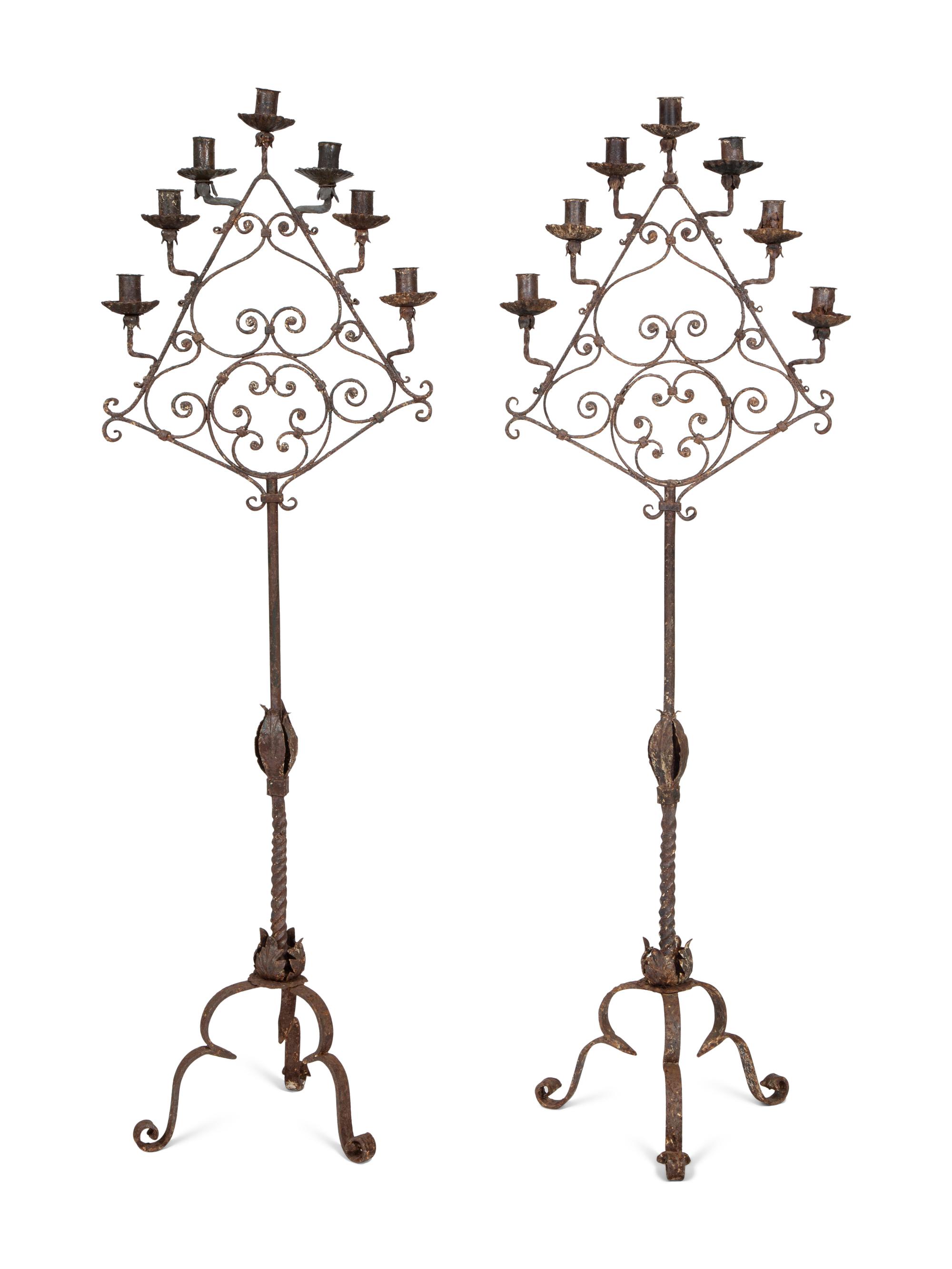 A Pair of Mizner Wrought Iron Seven-Light Floor Candelabra