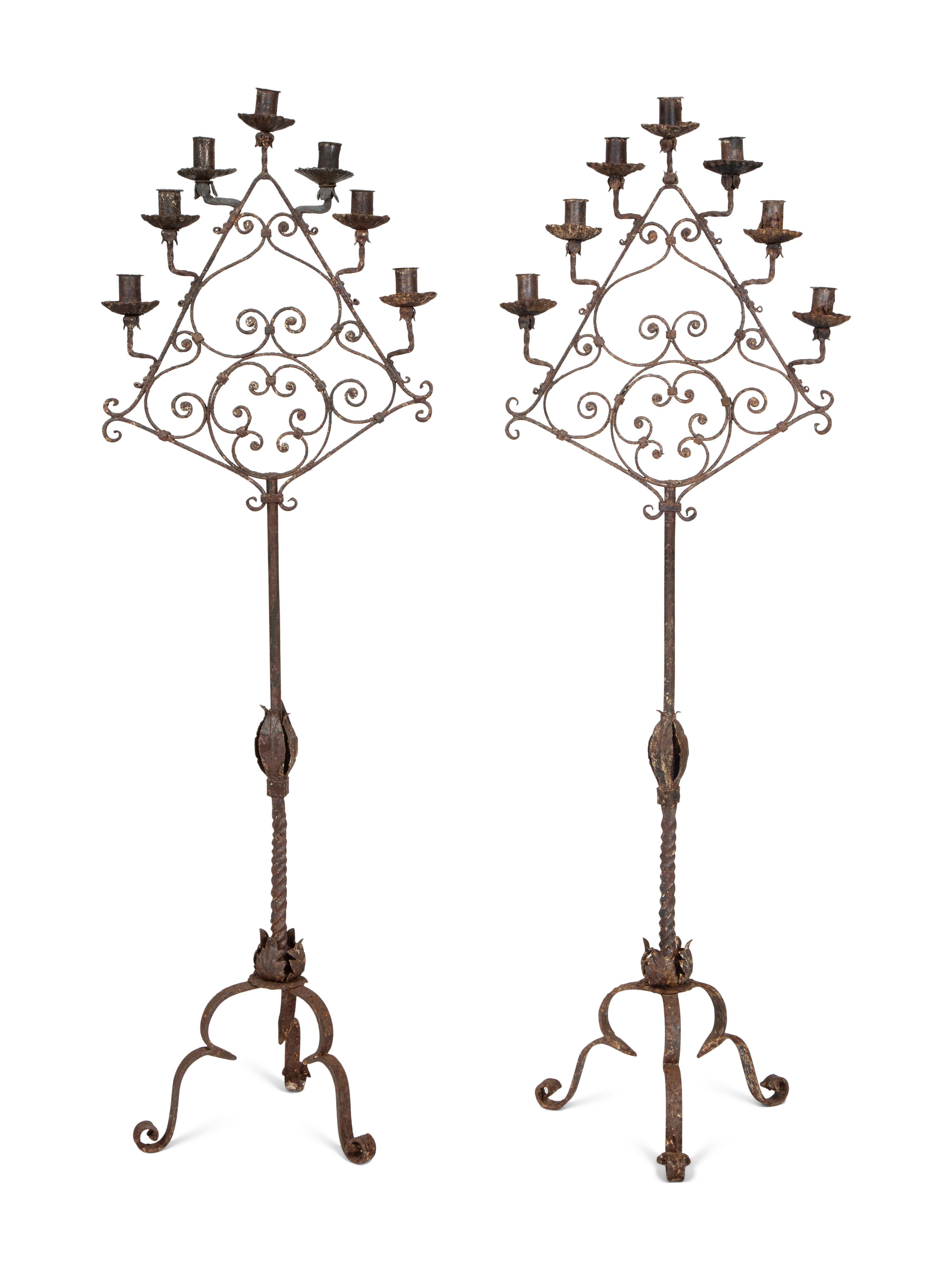 A Pair of Mizner Wrought Iron Seven-Light Floor Candelabra