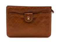 A Chanel Cognac Quilted Leather Clutch, 10 x 7 1/2 x 1 1/2 inches.