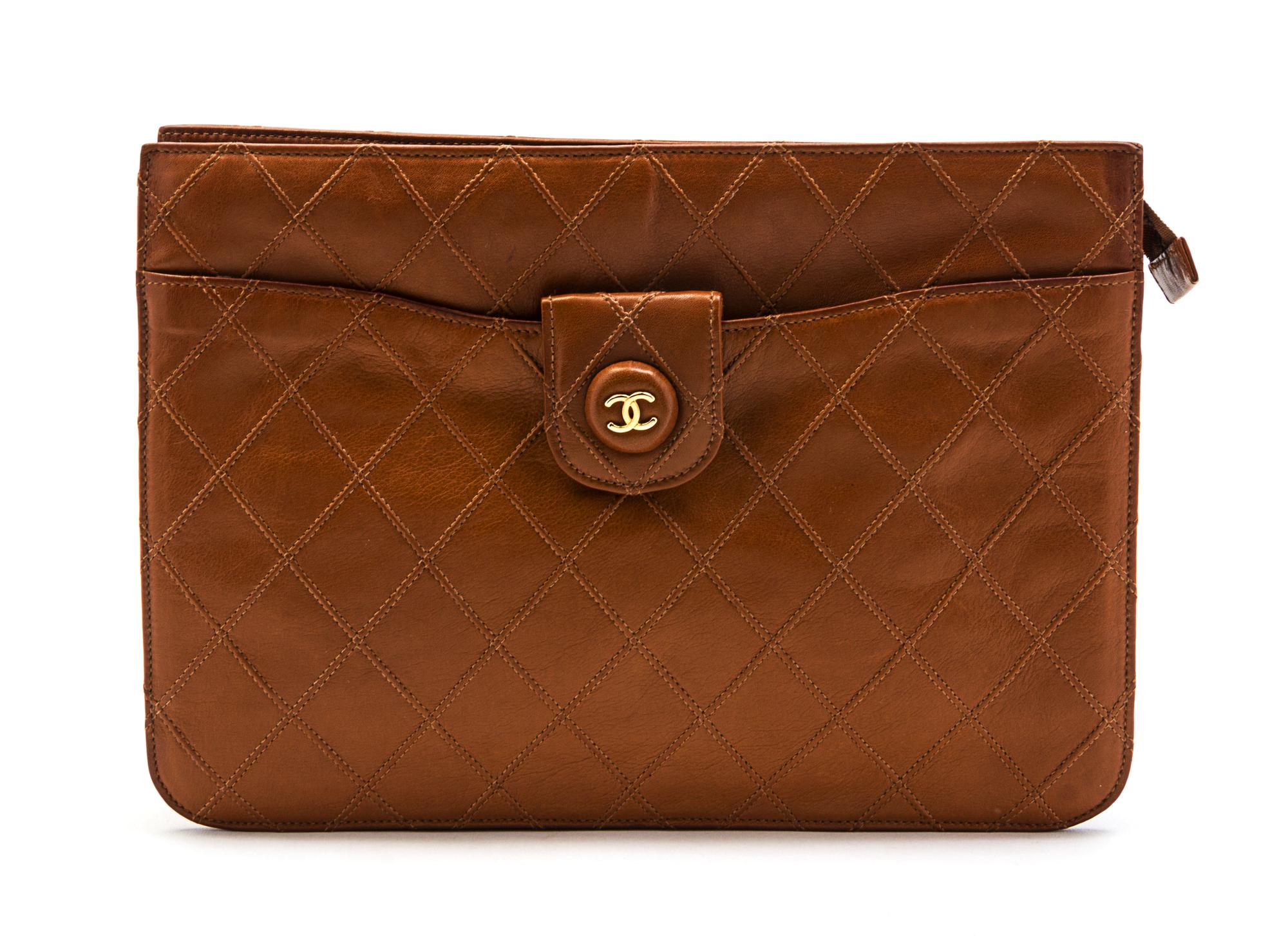 A Chanel Cognac Quilted Leather Clutch, 10 x 7 1/2 x 1 1/2 inches.