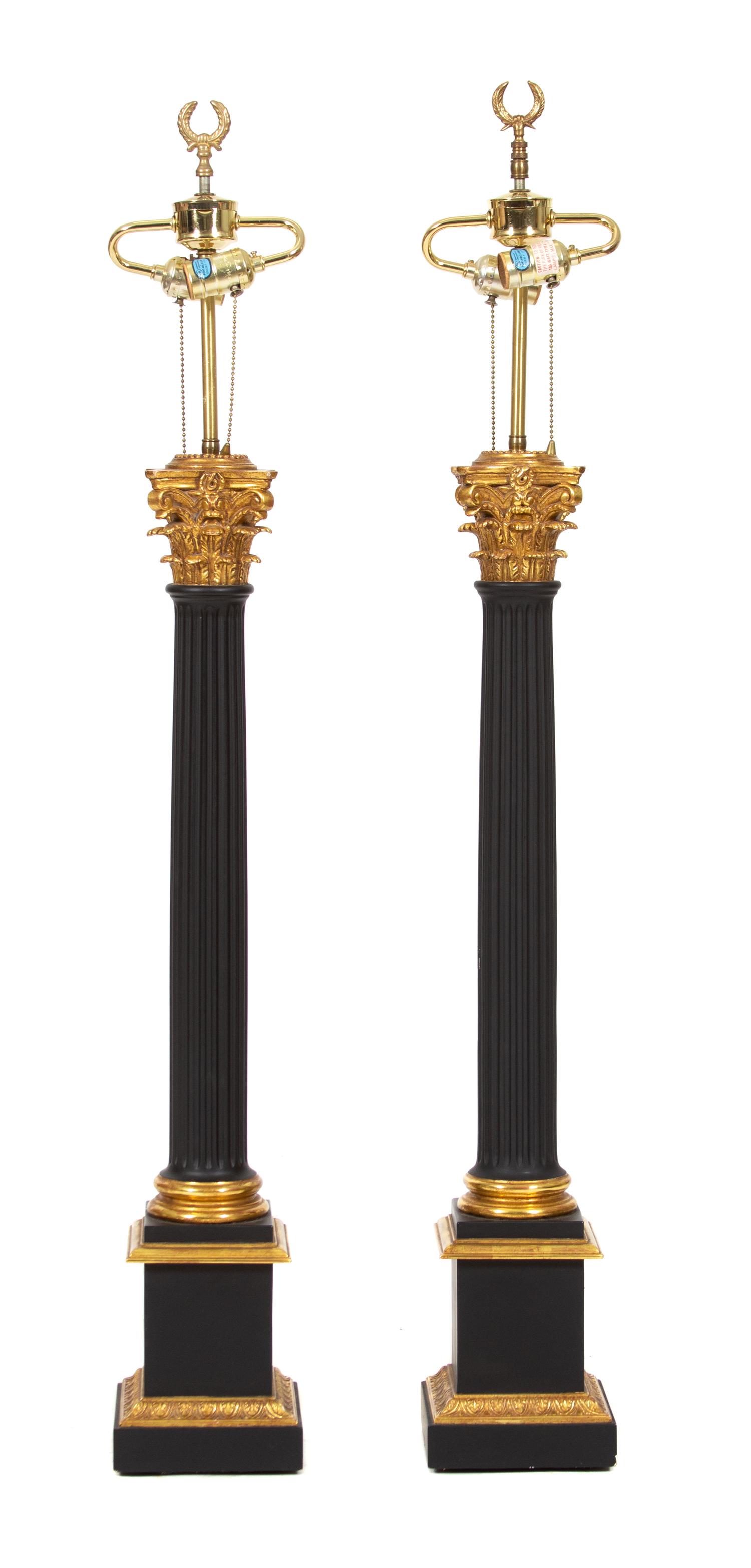 A Pair of Neoclasscial Style Ebonized and Gilt Metal Columnar Table Lamps Height 46 inches. — 20TH CENTURY