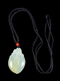 A Jadeite Peach-Form Pendant Length 1 1/2 inches. — 20TH CENTURY