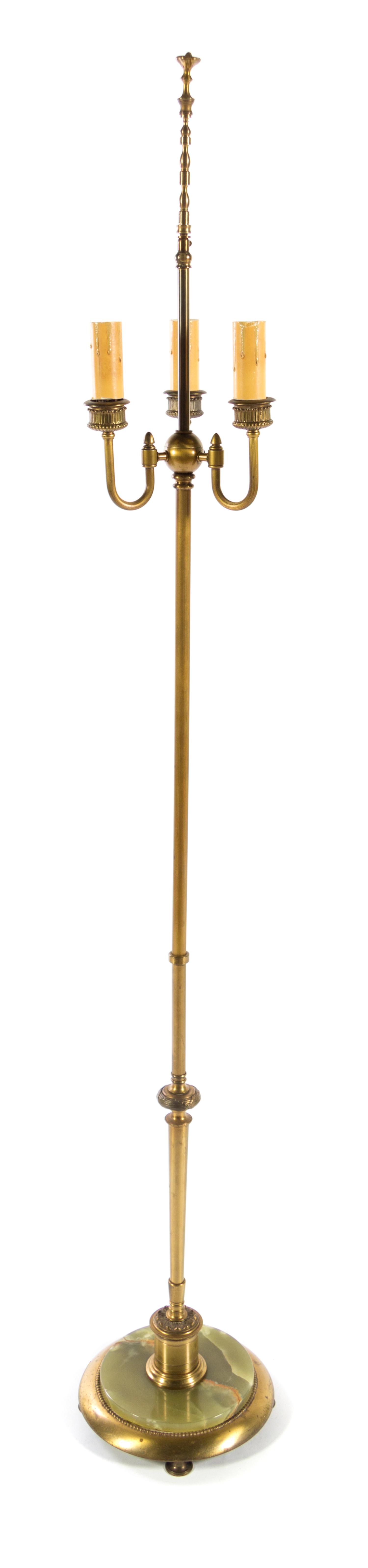 A Brass and Onyx Floor Lamp Height overall 64 1/2 inches.