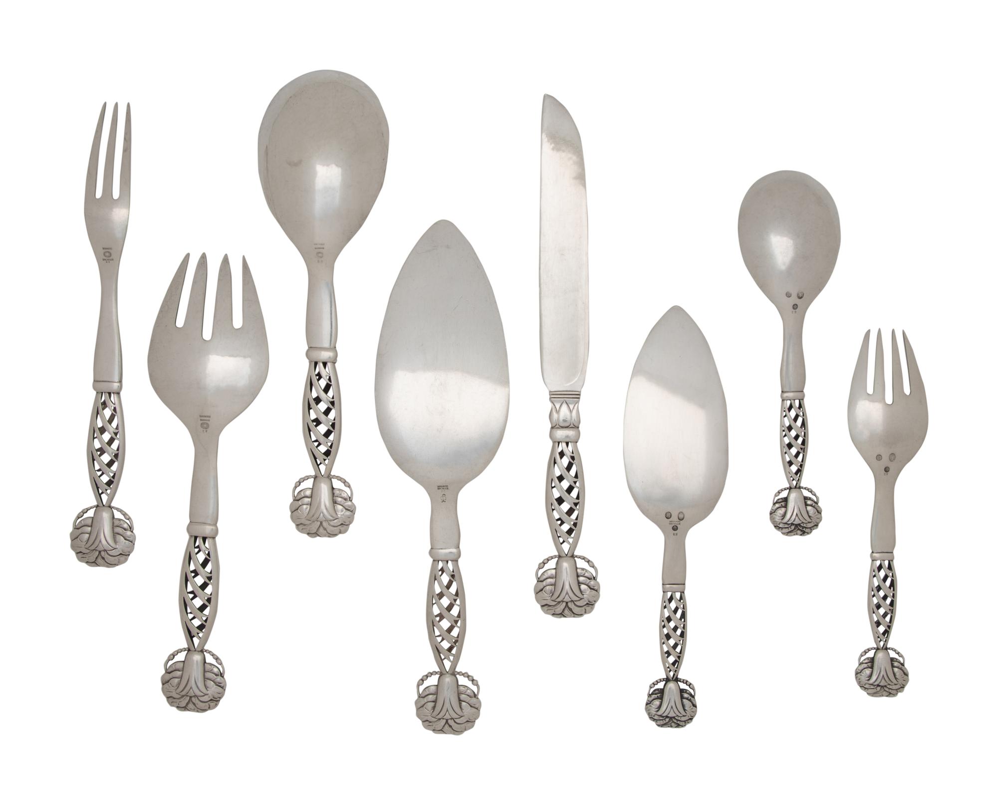 A Group of Eight Georg Jensen Silver Ornamental Serving Articles