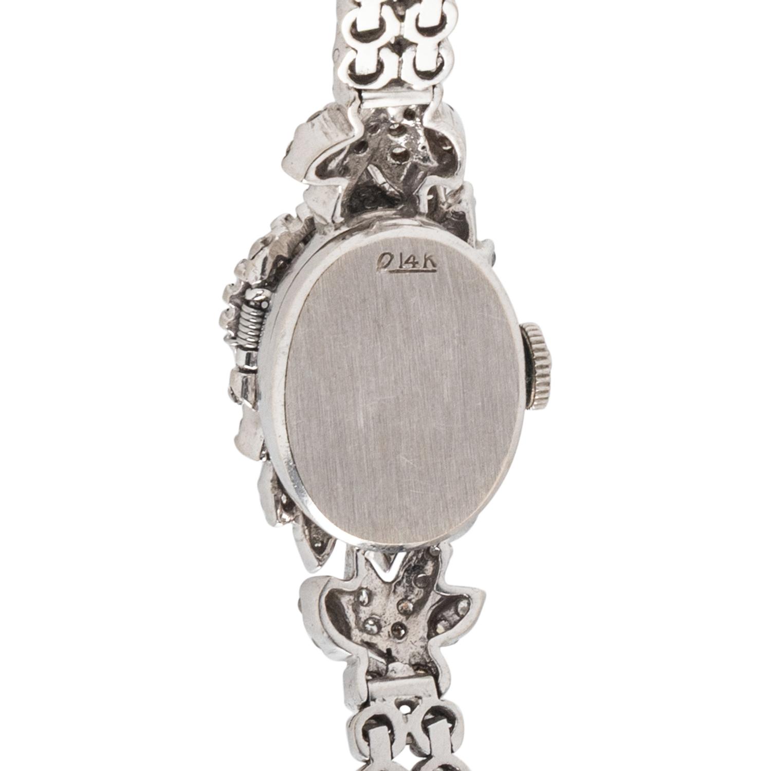 HAMILTON, DIAMOND AND 14K WHITE GOLD SURPRISE WATCH