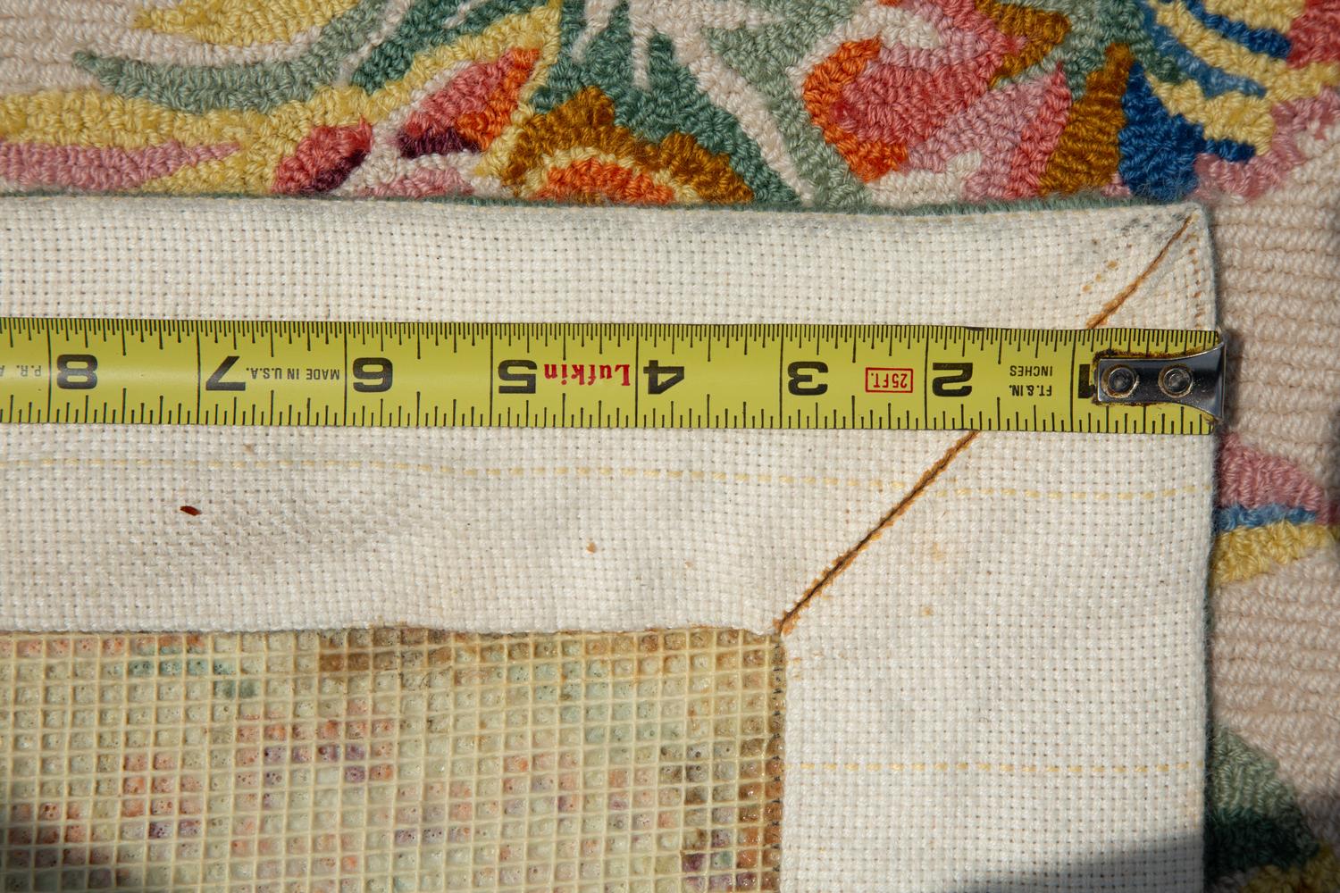 A Machine-Made Wool Floral Design Rug