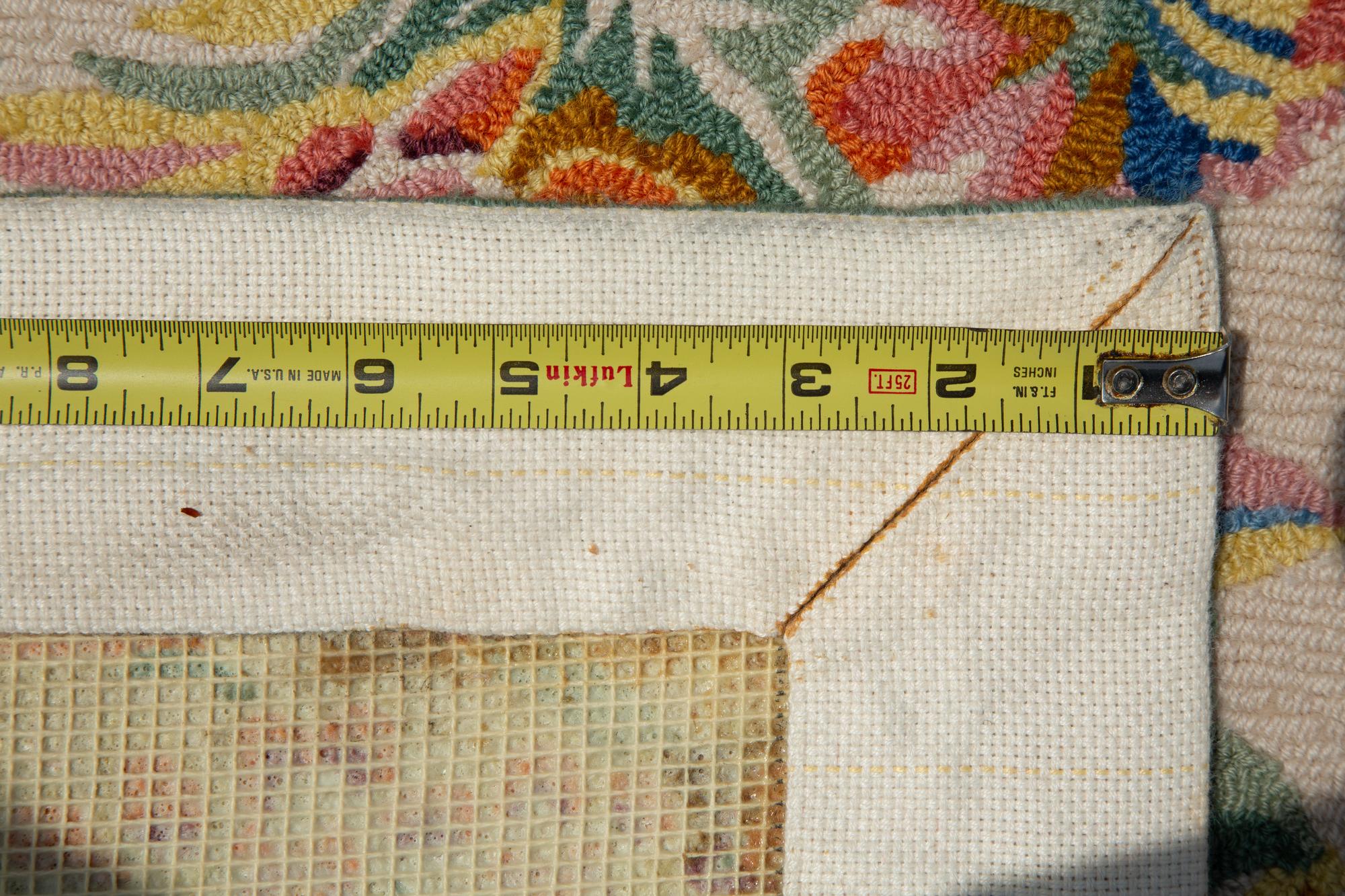 A Machine-Made Wool Floral Design Rug