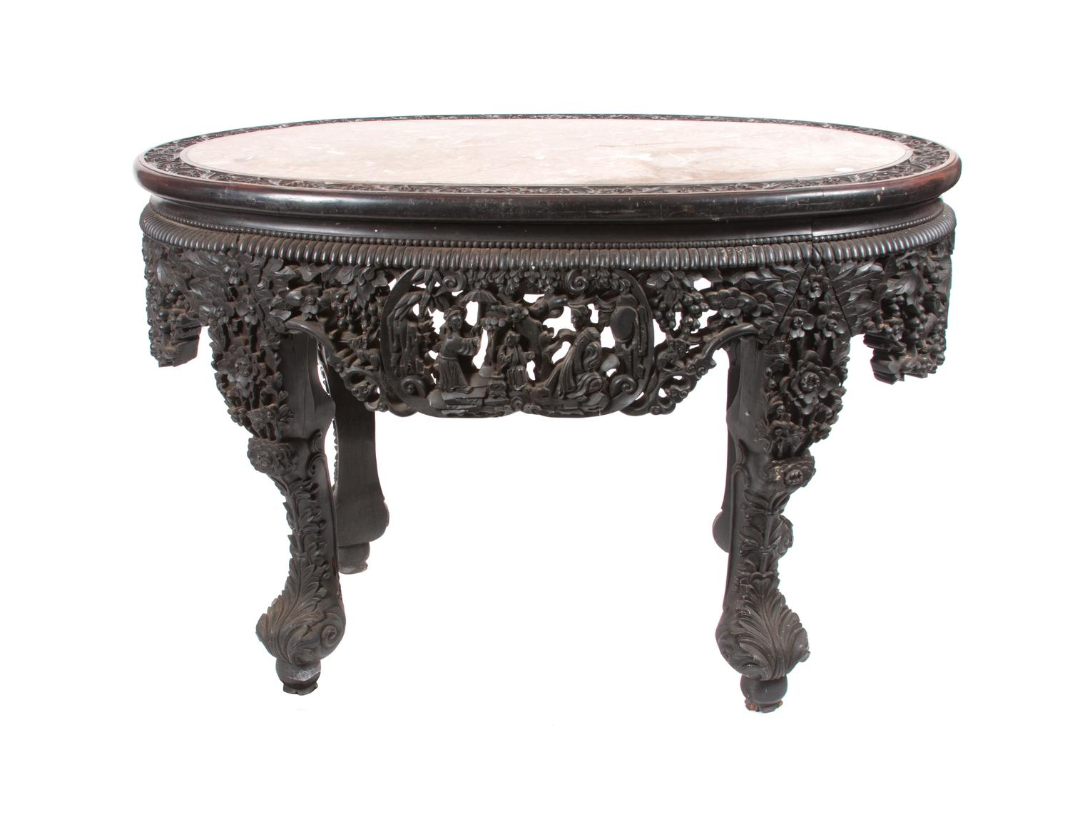 An Oval Chinese Export Marble Top Table Height 31 x width 48 x depth 31 1/4 inches.