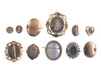 [EARLY PHOTOGRAPHY]. A group of 11 daguerreian brooches containing 13 portraits of men and women.