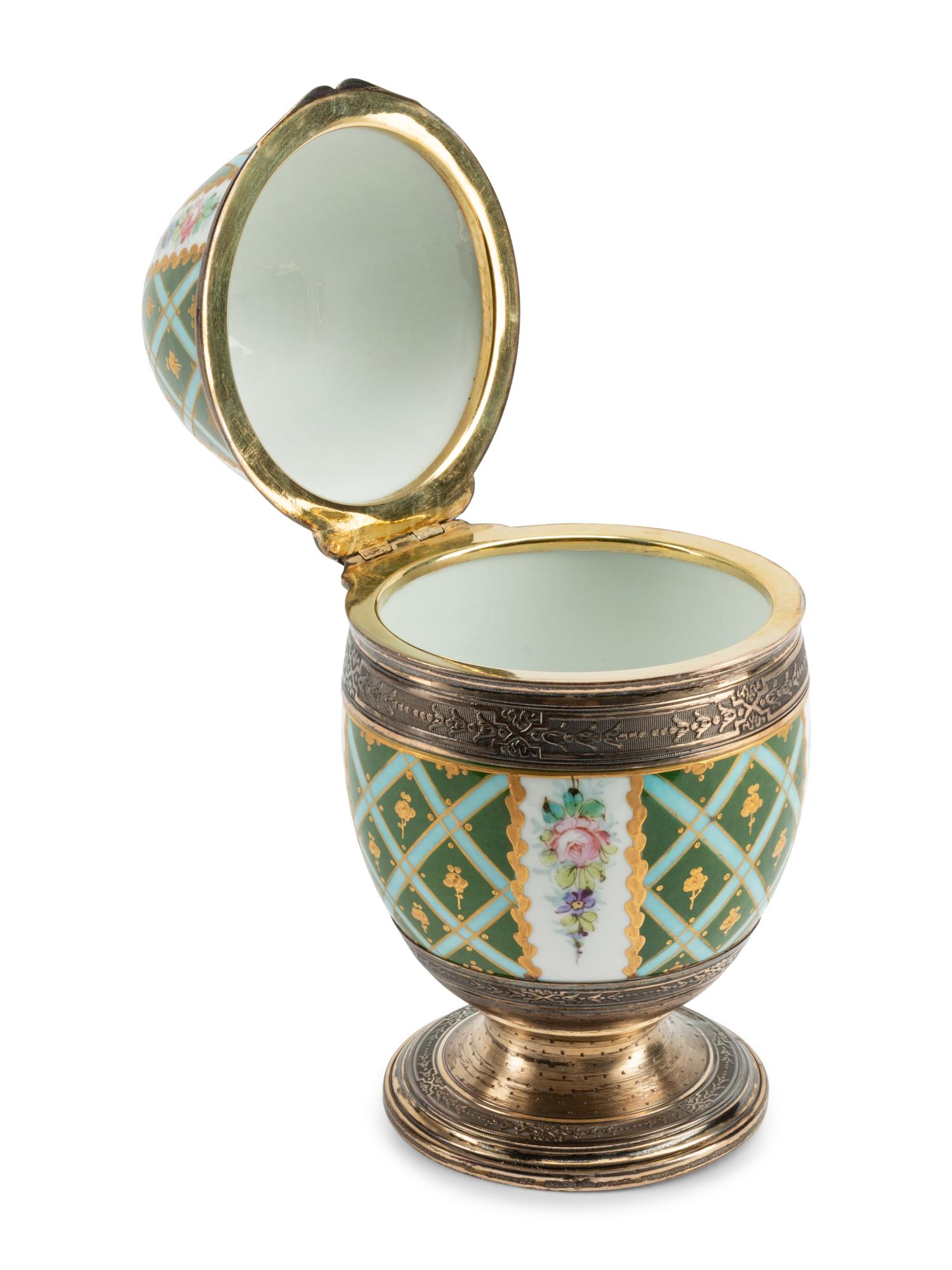 A Continental Silver Mounted Porcelain Egg-Form Box