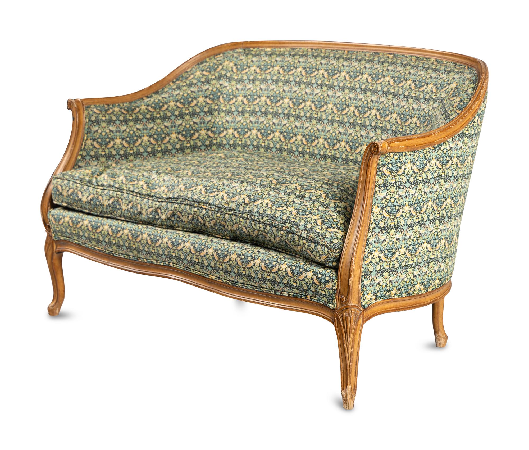 A Louis XV Style Settee with Strawberry Thief Upholstery