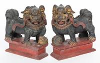 A Pair of Chinese Carved and Painted Foo Dogs Height 9 inches.