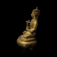 A Tibetan Gilt Copper Alloy Figure of Padmasambava, 18th/19th Century or Earlier 十八/十九世紀或更早 銅合金蓮花生坐像