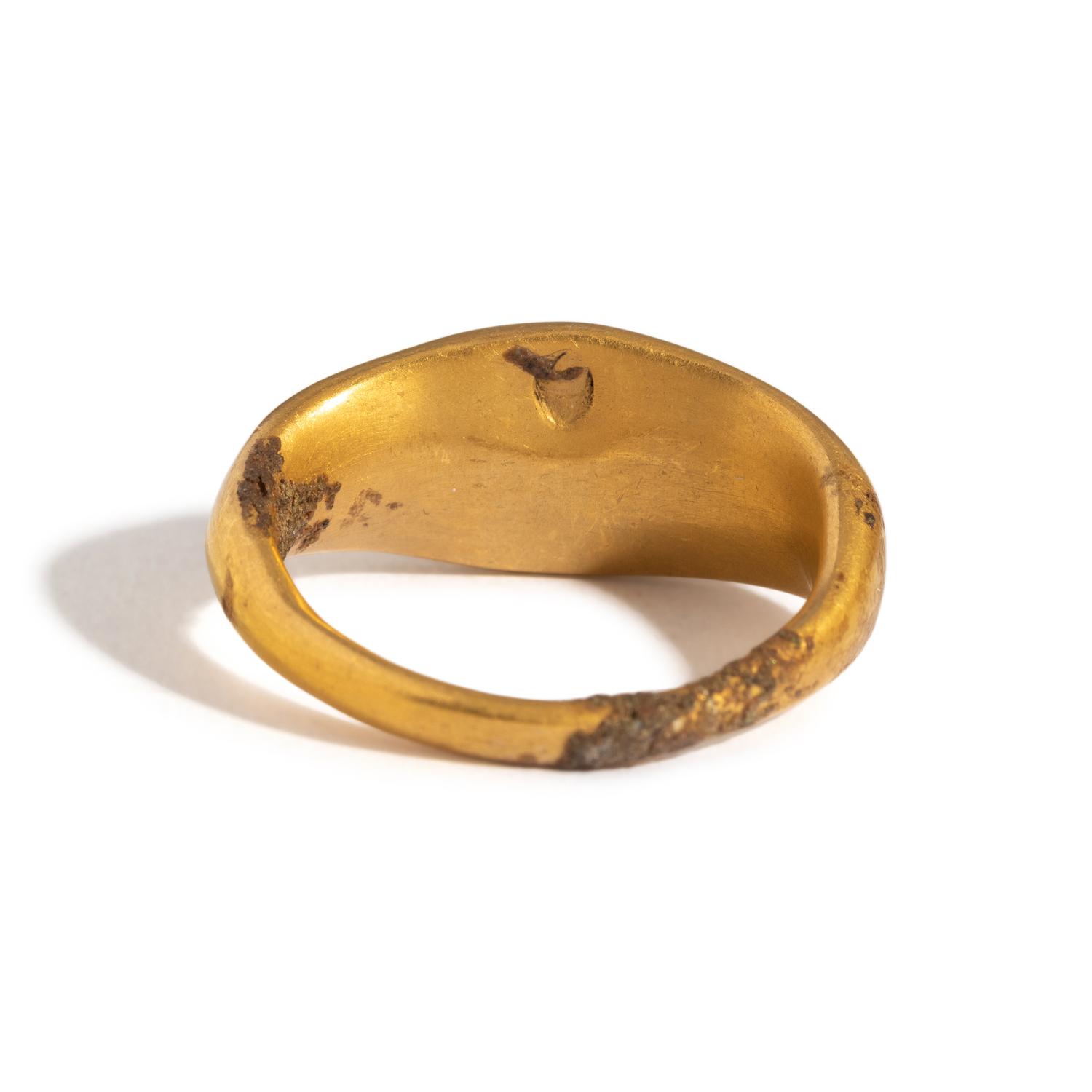 A Greek Gold and Garnet Finger Ring with a Prancing Stag