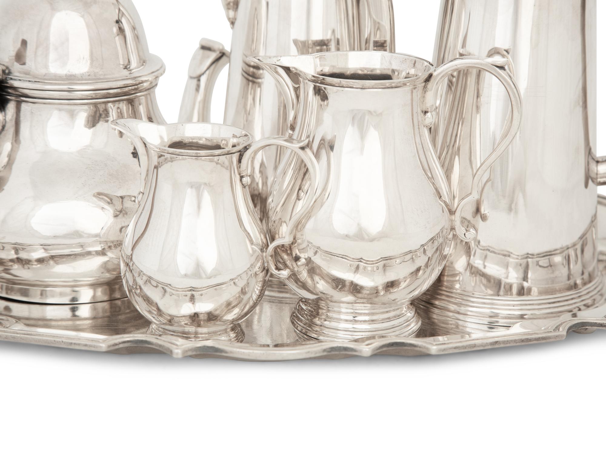 An English Queen Anne Style Silver Five-Piece Tea and Coffee Service