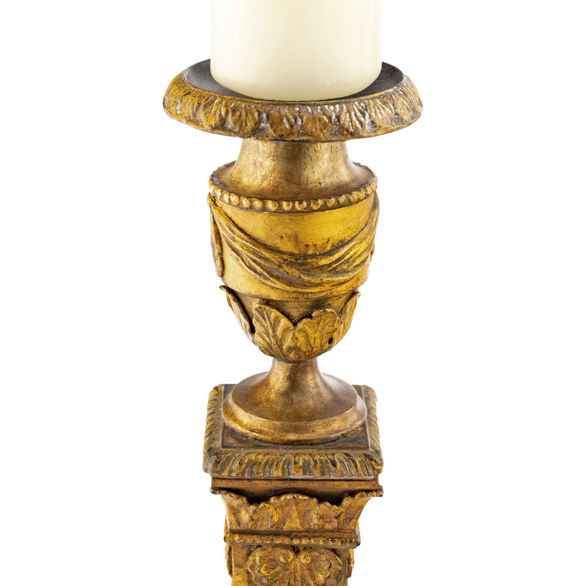 A Pair of Continental Gilt Iron Candlesticks