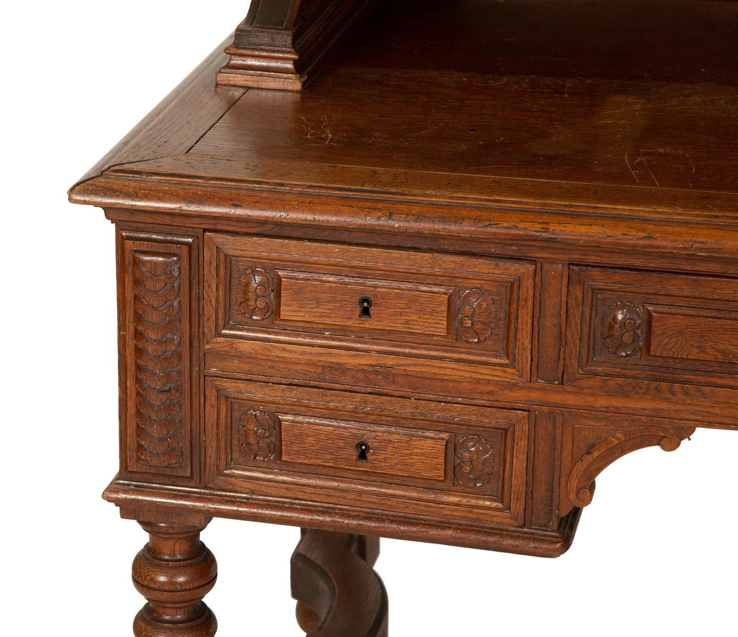 An English Carved Oak Bureau Cabinet